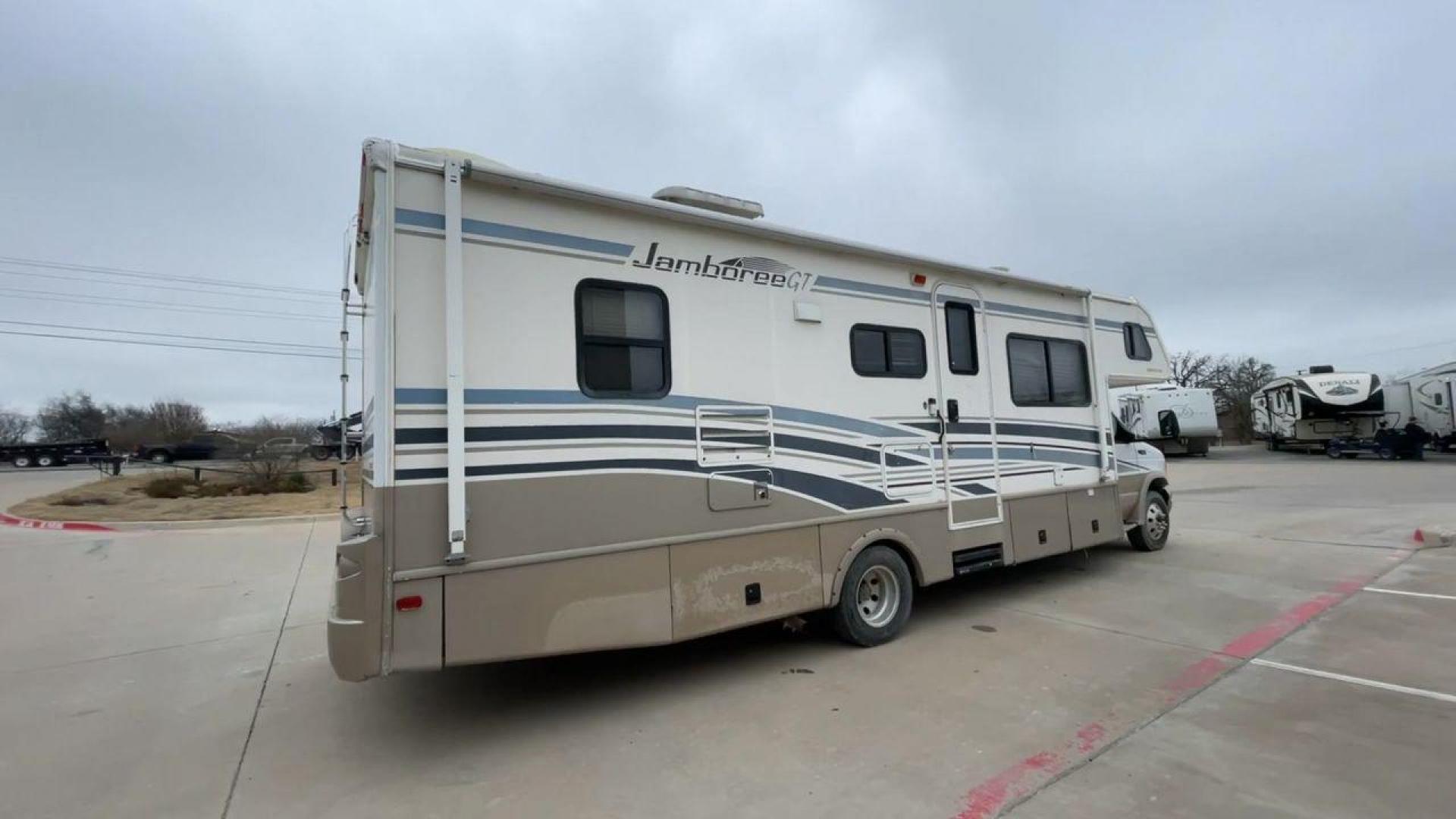 2003 WHITE FLEETWOOD JAMBOREE GT E450 (1FDXE45S93H) with an 6.8L V10 SOHC 20V engine, located at 4319 N Main Street, Cleburne, TX, 76033, (817) 221-0660, 32.435829, -97.384178 - The 2003 Fleetwood Jamboree GT allows you to enjoy the beauty of nature. Experience the ultimate in RV luxury with rear roof access, providing unparalleled views from the comfort of your mobile abode. With a spacious awning and a slide-out feature, you'll have plenty of room to enjoy the outdoors an - Photo#1