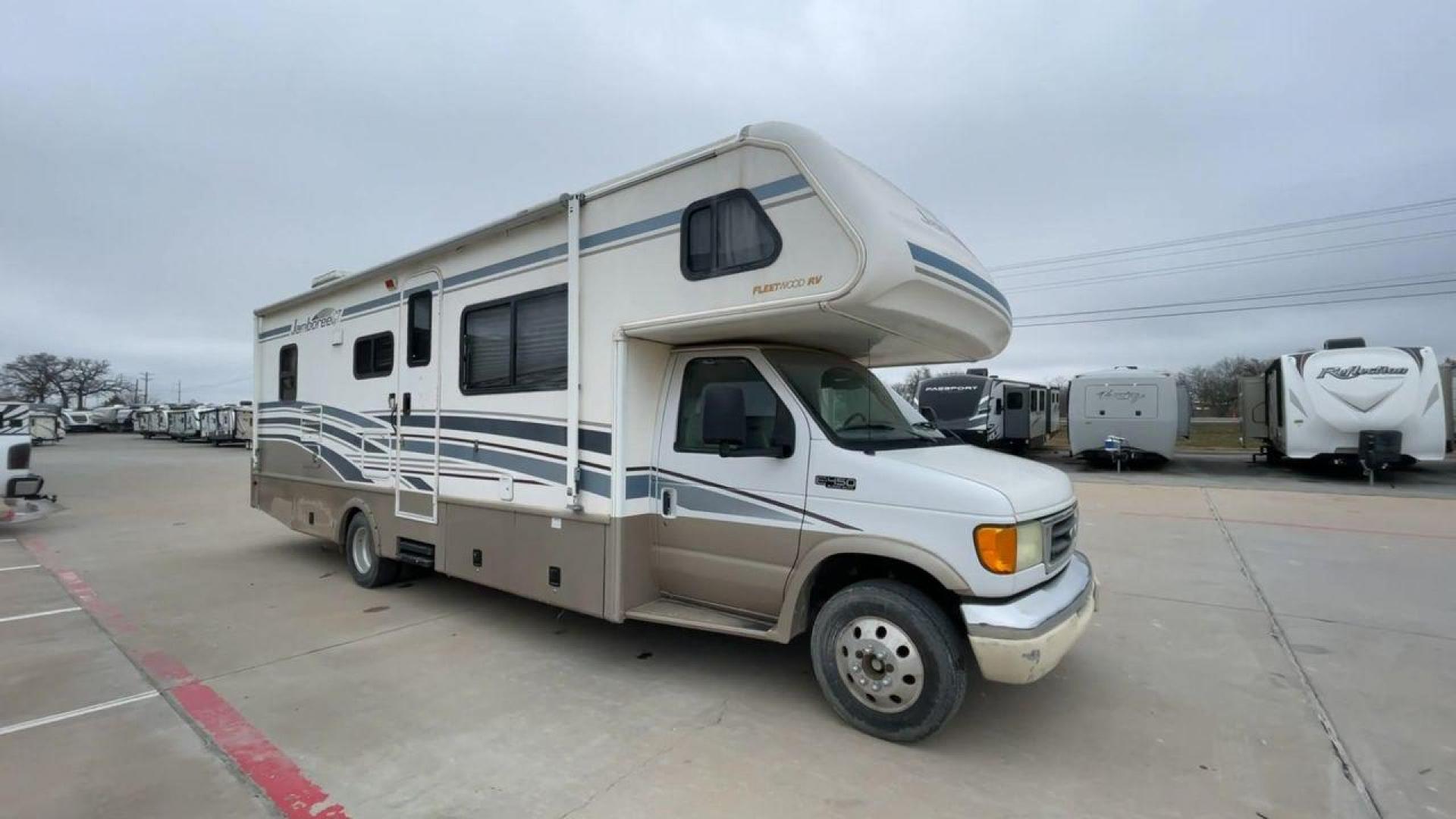 2003 WHITE FLEETWOOD JAMBOREE GT E450 (1FDXE45S93H) with an 6.8L V10 SOHC 20V engine, located at 4319 N Main Street, Cleburne, TX, 76033, (817) 221-0660, 32.435829, -97.384178 - The 2003 Fleetwood Jamboree GT allows you to enjoy the beauty of nature. Experience the ultimate in RV luxury with rear roof access, providing unparalleled views from the comfort of your mobile abode. With a spacious awning and a slide-out feature, you'll have plenty of room to enjoy the outdoors an - Photo#3