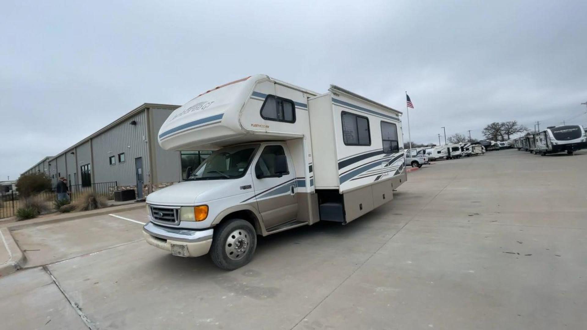 2003 WHITE FLEETWOOD JAMBOREE GT E450 (1FDXE45S93H) with an 6.8L V10 SOHC 20V engine, located at 4319 N Main Street, Cleburne, TX, 76033, (817) 221-0660, 32.435829, -97.384178 - The 2003 Fleetwood Jamboree GT allows you to enjoy the beauty of nature. Experience the ultimate in RV luxury with rear roof access, providing unparalleled views from the comfort of your mobile abode. With a spacious awning and a slide-out feature, you'll have plenty of room to enjoy the outdoors an - Photo#5