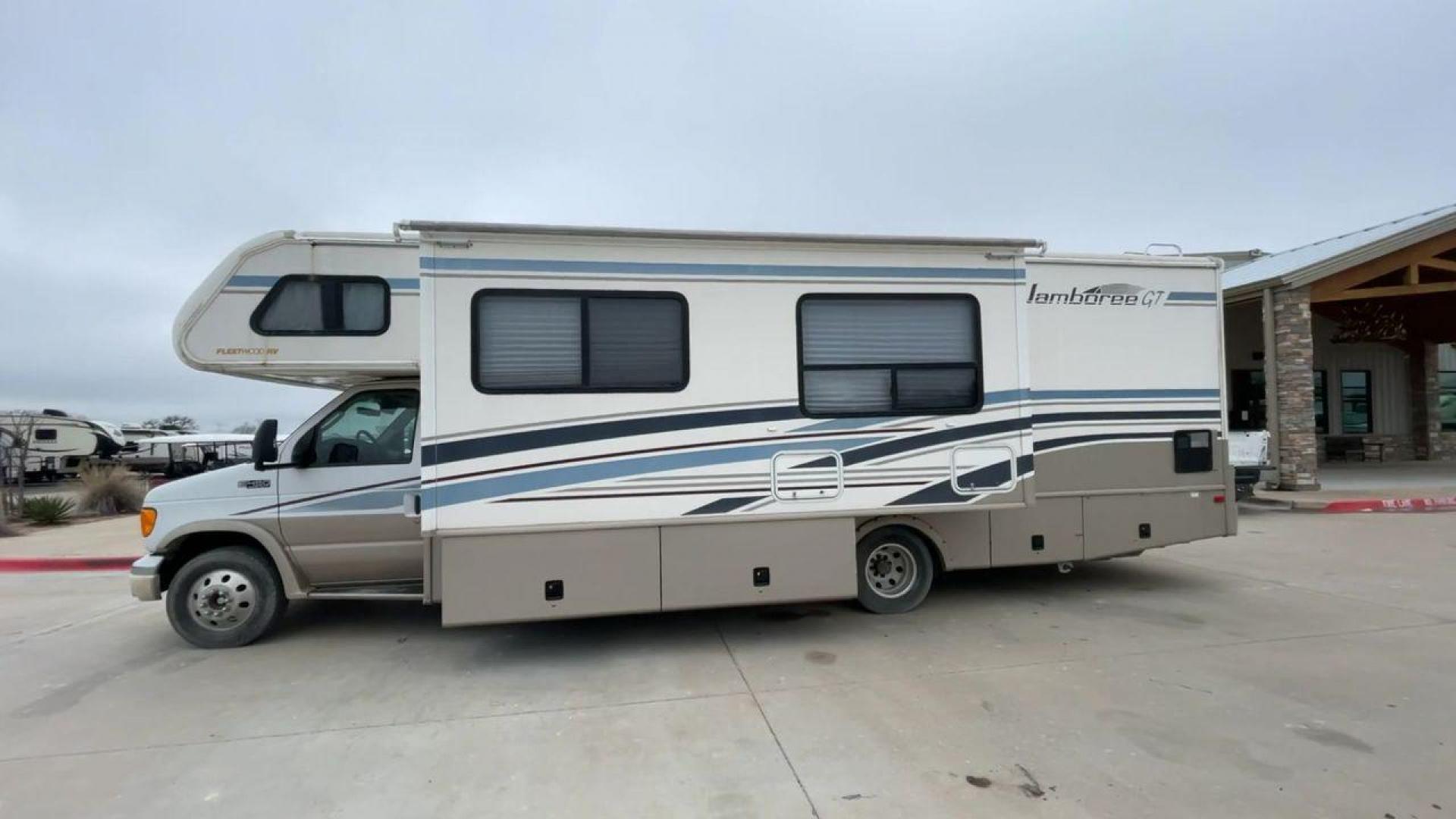 2003 WHITE FLEETWOOD JAMBOREE GT E450 (1FDXE45S93H) with an 6.8L V10 SOHC 20V engine, located at 4319 N Main Street, Cleburne, TX, 76033, (817) 221-0660, 32.435829, -97.384178 - The 2003 Fleetwood Jamboree GT allows you to enjoy the beauty of nature. Experience the ultimate in RV luxury with rear roof access, providing unparalleled views from the comfort of your mobile abode. With a spacious awning and a slide-out feature, you'll have plenty of room to enjoy the outdoors an - Photo#6