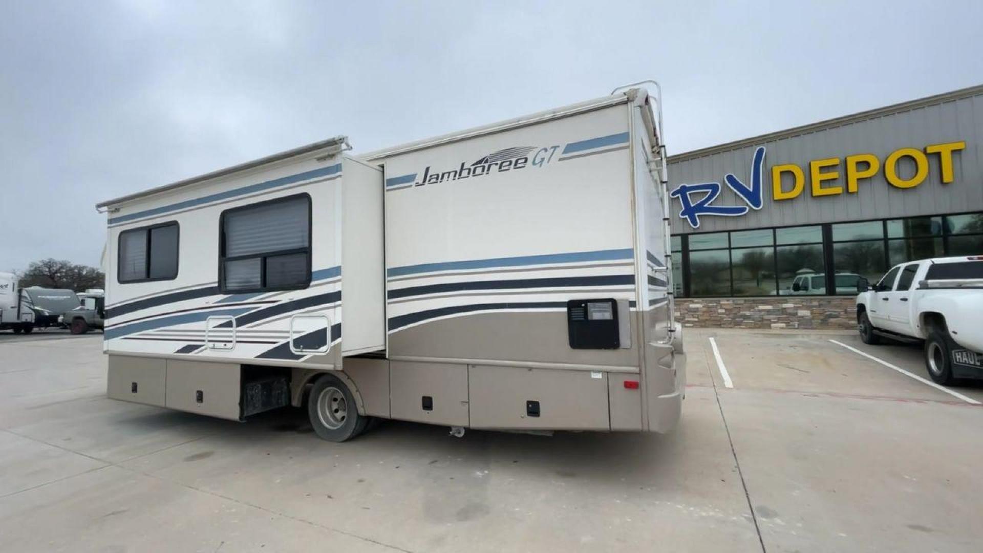 2003 WHITE FLEETWOOD JAMBOREE GT E450 (1FDXE45S93H) with an 6.8L V10 SOHC 20V engine, located at 4319 N Main Street, Cleburne, TX, 76033, (817) 221-0660, 32.435829, -97.384178 - The 2003 Fleetwood Jamboree GT allows you to enjoy the beauty of nature. Experience the ultimate in RV luxury with rear roof access, providing unparalleled views from the comfort of your mobile abode. With a spacious awning and a slide-out feature, you'll have plenty of room to enjoy the outdoors an - Photo#7