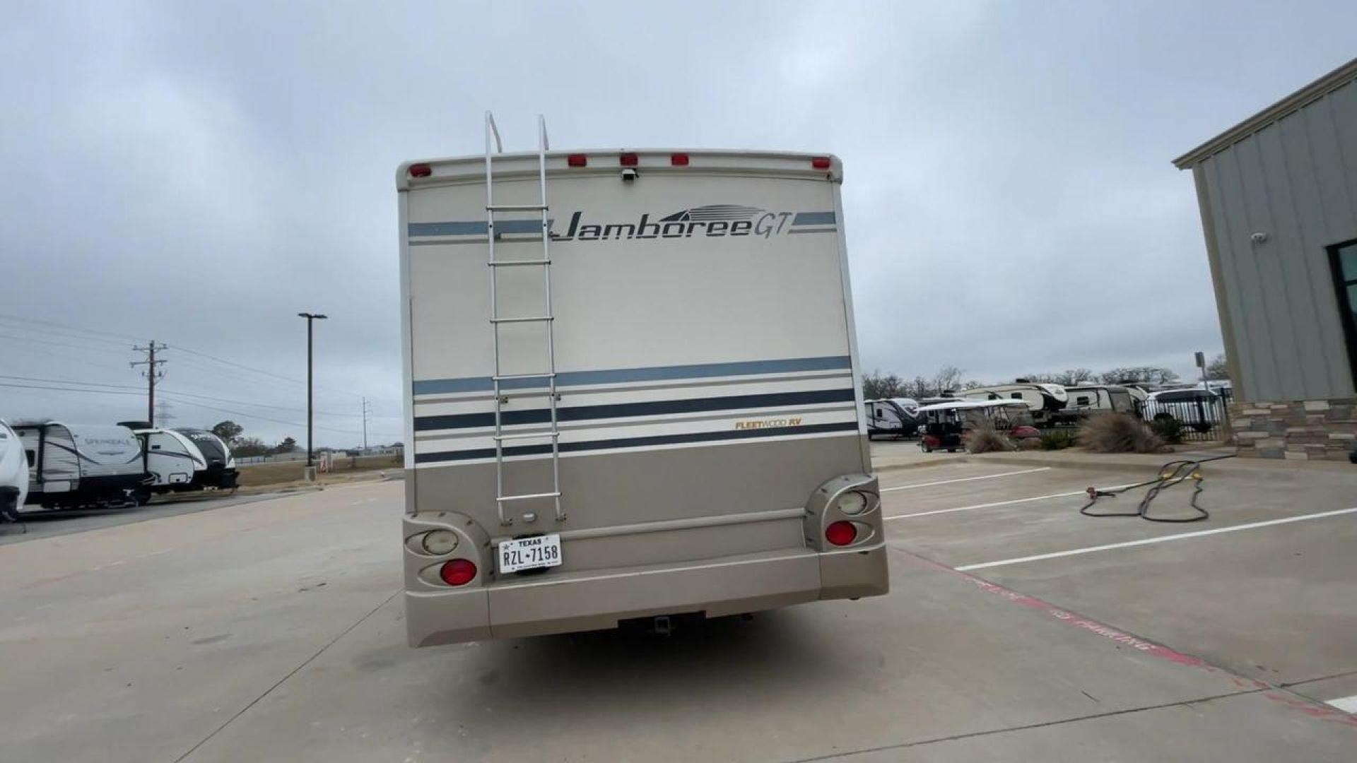 2003 WHITE FLEETWOOD JAMBOREE GT E450 (1FDXE45S93H) with an 6.8L V10 SOHC 20V engine, located at 4319 N Main Street, Cleburne, TX, 76033, (817) 221-0660, 32.435829, -97.384178 - The 2003 Fleetwood Jamboree GT allows you to enjoy the beauty of nature. Experience the ultimate in RV luxury with rear roof access, providing unparalleled views from the comfort of your mobile abode. With a spacious awning and a slide-out feature, you'll have plenty of room to enjoy the outdoors an - Photo#8