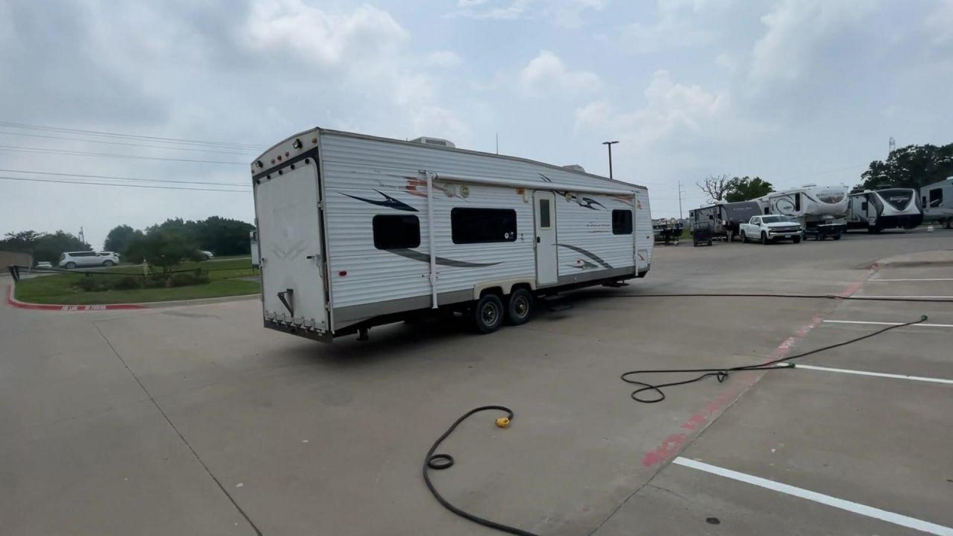 2008 WHITE ADRENALINE 23FS (1TC2B180683) , Length: 28.67 ft | Dry Weight: 6,474 lbs | Gross Weight: 9,500 lbs | Slides: 9 transmission, located at 4319 N Main Street, Cleburne, TX, 76033, (817) 221-0660, 32.435829, -97.384178 - The 2008 Adrenaline 23FS Toy Hauler is prepared for a journey! It is 28.67 feet long and weighs 6,474 pounds when dry. It's lightweight and portable, but large enough to hold all of your favorite toys and accessories. It can accommodate up to 9,500 pounds, so you'll have plenty of room for your next - Photo#1