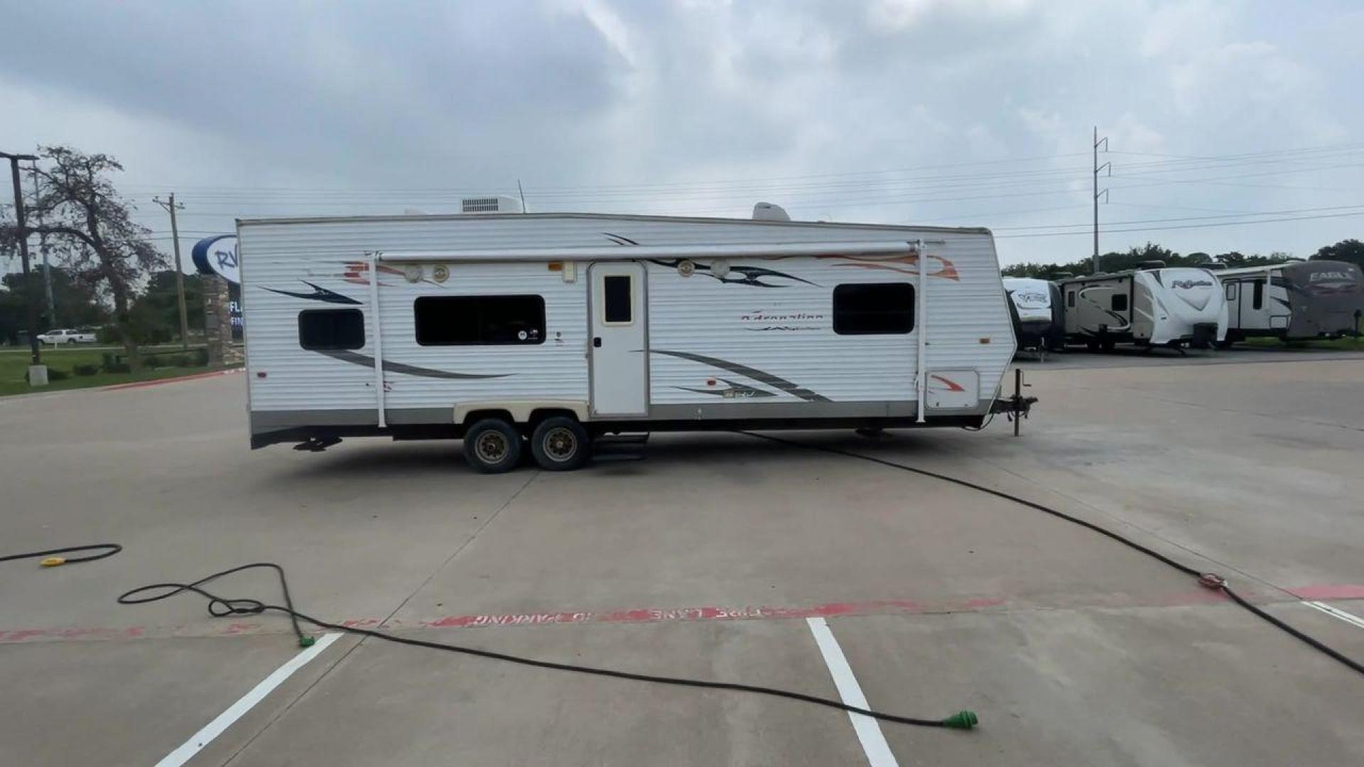 2008 WHITE ADRENALINE 23FS (1TC2B180683) , Length: 28.67 ft | Dry Weight: 6,474 lbs | Gross Weight: 9,500 lbs | Slides: 9 transmission, located at 4319 N Main Street, Cleburne, TX, 76033, (817) 221-0660, 32.435829, -97.384178 - The 2008 Adrenaline 23FS Toy Hauler is prepared for a journey! It is 28.67 feet long and weighs 6,474 pounds when dry. It's lightweight and portable, but large enough to hold all of your favorite toys and accessories. It can accommodate up to 9,500 pounds, so you'll have plenty of room for your next - Photo#2