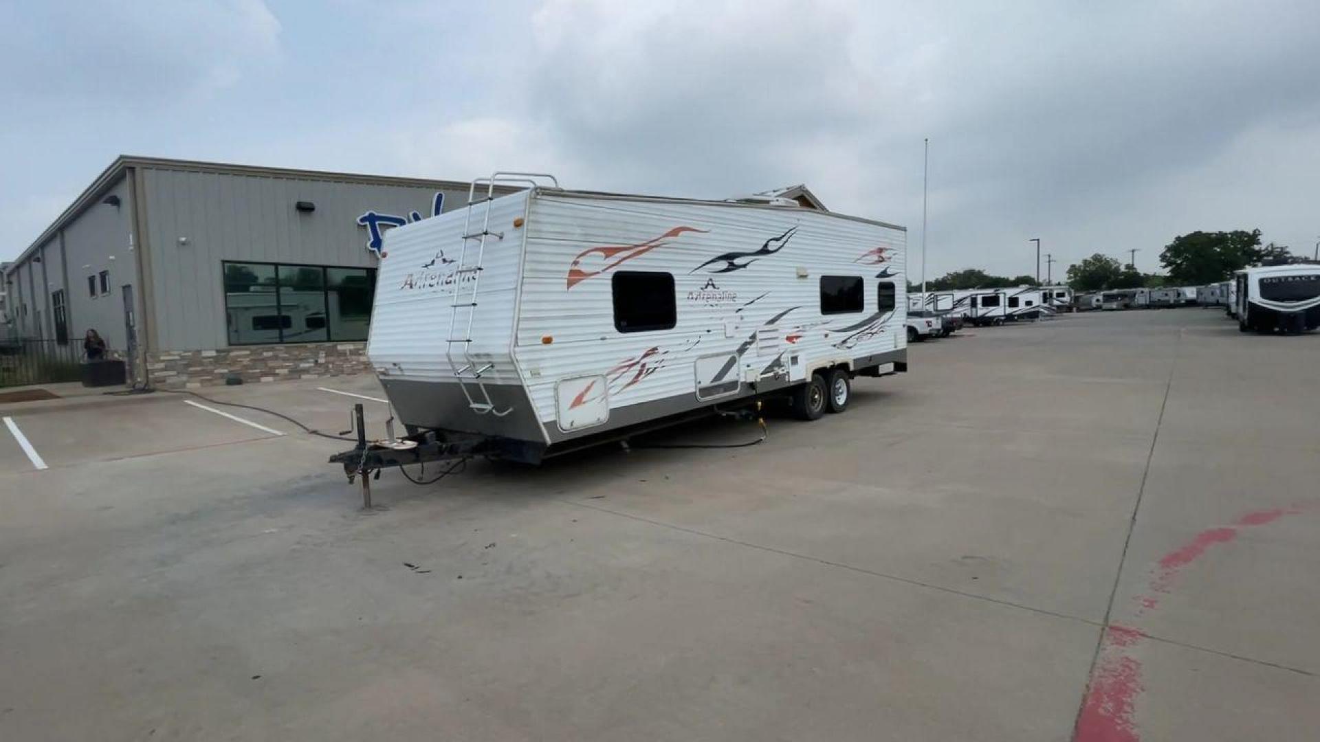 2008 WHITE ADRENALINE 23FS (1TC2B180683) , Length: 28.67 ft | Dry Weight: 6,474 lbs | Gross Weight: 9,500 lbs | Slides: 9 transmission, located at 4319 N Main Street, Cleburne, TX, 76033, (817) 221-0660, 32.435829, -97.384178 - The 2008 Adrenaline 23FS Toy Hauler is prepared for a journey! It is 28.67 feet long and weighs 6,474 pounds when dry. It's lightweight and portable, but large enough to hold all of your favorite toys and accessories. It can accommodate up to 9,500 pounds, so you'll have plenty of room for your next - Photo#5