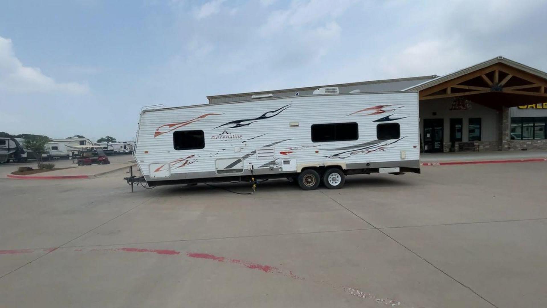 2008 WHITE ADRENALINE 23FS (1TC2B180683) , Length: 28.67 ft | Dry Weight: 6,474 lbs | Gross Weight: 9,500 lbs | Slides: 9 transmission, located at 4319 N Main Street, Cleburne, TX, 76033, (817) 221-0660, 32.435829, -97.384178 - The 2008 Adrenaline 23FS Toy Hauler is prepared for a journey! It is 28.67 feet long and weighs 6,474 pounds when dry. It's lightweight and portable, but large enough to hold all of your favorite toys and accessories. It can accommodate up to 9,500 pounds, so you'll have plenty of room for your next - Photo#6