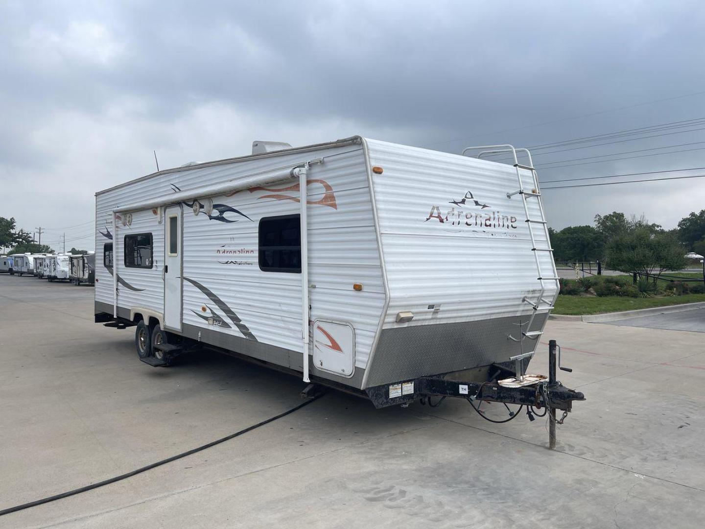 2008 WHITE ADRENALINE 23FS (1TC2B180683) , Length: 28.67 ft | Dry Weight: 6,474 lbs | Gross Weight: 9,500 lbs | Slides: 9 transmission, located at 4319 N Main Street, Cleburne, TX, 76033, (817) 221-0660, 32.435829, -97.384178 - The 2008 Adrenaline 23FS Toy Hauler is prepared for a journey! It is 28.67 feet long and weighs 6,474 pounds when dry. It's lightweight and portable, but large enough to hold all of your favorite toys and accessories. It can accommodate up to 9,500 pounds, so you'll have plenty of room for your next - Photo#23