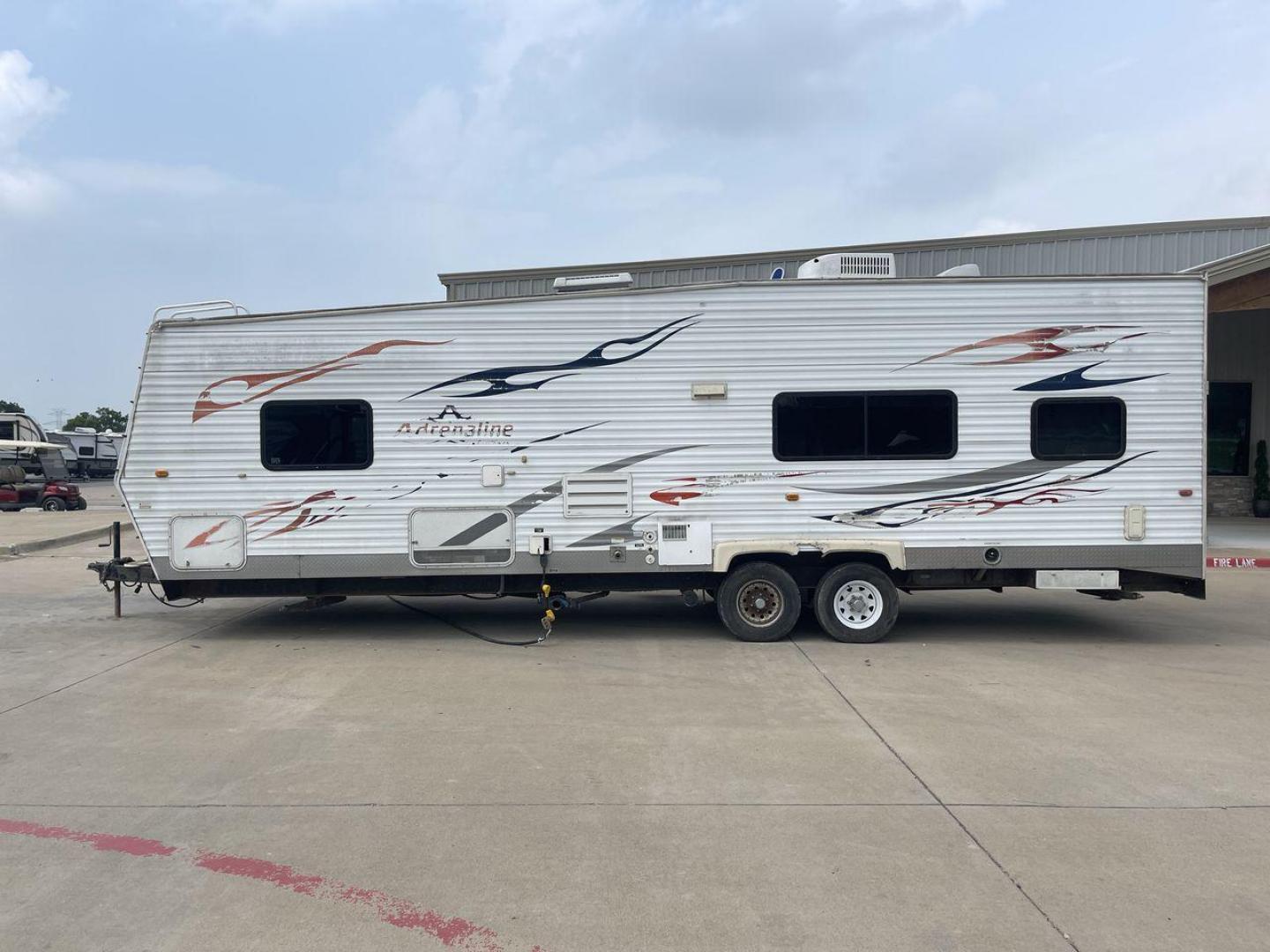 2008 WHITE ADRENALINE 23FS (1TC2B180683) , Length: 28.67 ft | Dry Weight: 6,474 lbs | Gross Weight: 9,500 lbs | Slides: 9 transmission, located at 4319 N Main Street, Cleburne, TX, 76033, (817) 221-0660, 32.435829, -97.384178 - The 2008 Adrenaline 23FS Toy Hauler is prepared for a journey! It is 28.67 feet long and weighs 6,474 pounds when dry. It's lightweight and portable, but large enough to hold all of your favorite toys and accessories. It can accommodate up to 9,500 pounds, so you'll have plenty of room for your next - Photo#24