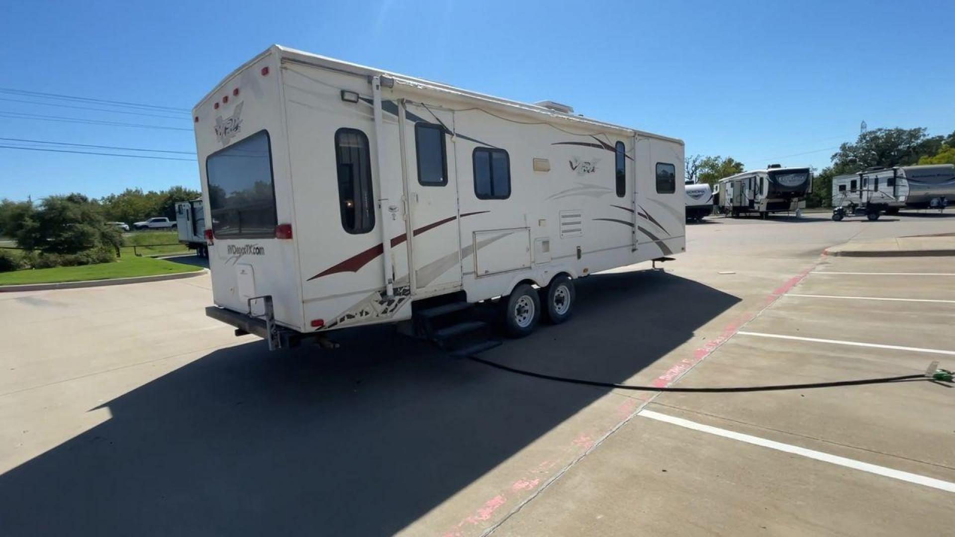 2008 WHITE VR-1 299RLS (4YDT299268V) , Length: 33 ft. | Dry Weight: 6,810 lbs. | Slides: 1 transmission, located at 4319 N Main Street, Cleburne, TX, 76033, (817) 221-0660, 32.435829, -97.384178 - The 2008 VR-1 299RLS is a dual-axle steel wheel setup measuring 33 ft. long and 11.17 ft. tall. It has a dry weight of 6,810 lbs. and a payload capacity of 2,805 lbs. It also has a hitch weight of 815 lbs. It includes one slide and one power awning. This travel trailer features a rear living floorpl - Photo#1