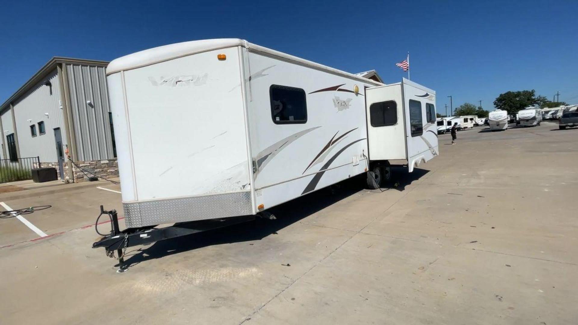 2008 WHITE VR-1 299RLS (4YDT299268V) , Length: 33 ft. | Dry Weight: 6,810 lbs. | Slides: 1 transmission, located at 4319 N Main Street, Cleburne, TX, 76033, (817) 221-0660, 32.435829, -97.384178 - The 2008 VR-1 299RLS is a dual-axle steel wheel setup measuring 33 ft. long and 11.17 ft. tall. It has a dry weight of 6,810 lbs. and a payload capacity of 2,805 lbs. It also has a hitch weight of 815 lbs. It includes one slide and one power awning. This travel trailer features a rear living floorpl - Photo#5