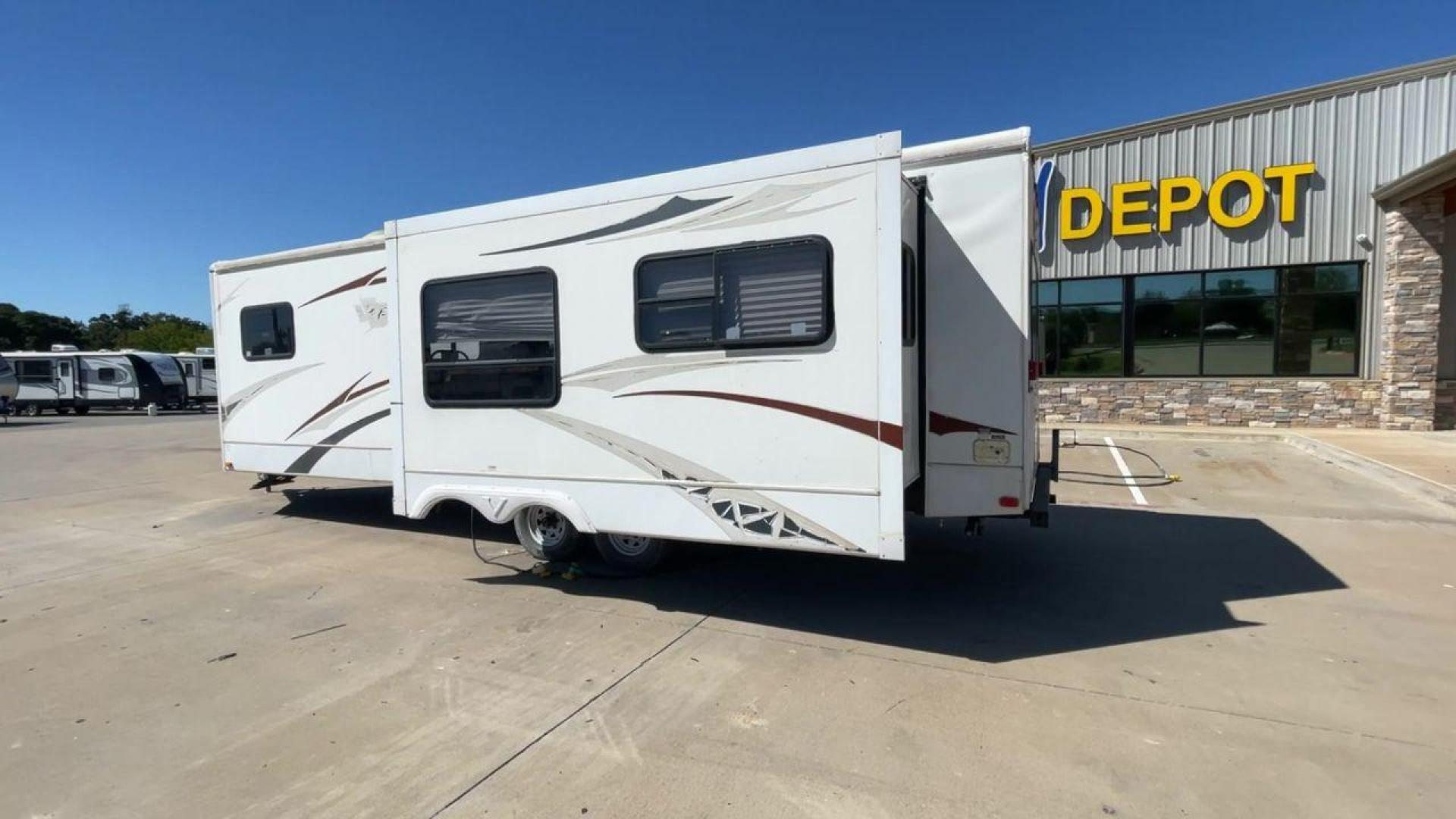 2008 WHITE VR-1 299RLS (4YDT299268V) , Length: 33 ft. | Dry Weight: 6,810 lbs. | Slides: 1 transmission, located at 4319 N Main Street, Cleburne, TX, 76033, (817) 221-0660, 32.435829, -97.384178 - The 2008 VR-1 299RLS is a dual-axle steel wheel setup measuring 33 ft. long and 11.17 ft. tall. It has a dry weight of 6,810 lbs. and a payload capacity of 2,805 lbs. It also has a hitch weight of 815 lbs. It includes one slide and one power awning. This travel trailer features a rear living floorpl - Photo#7