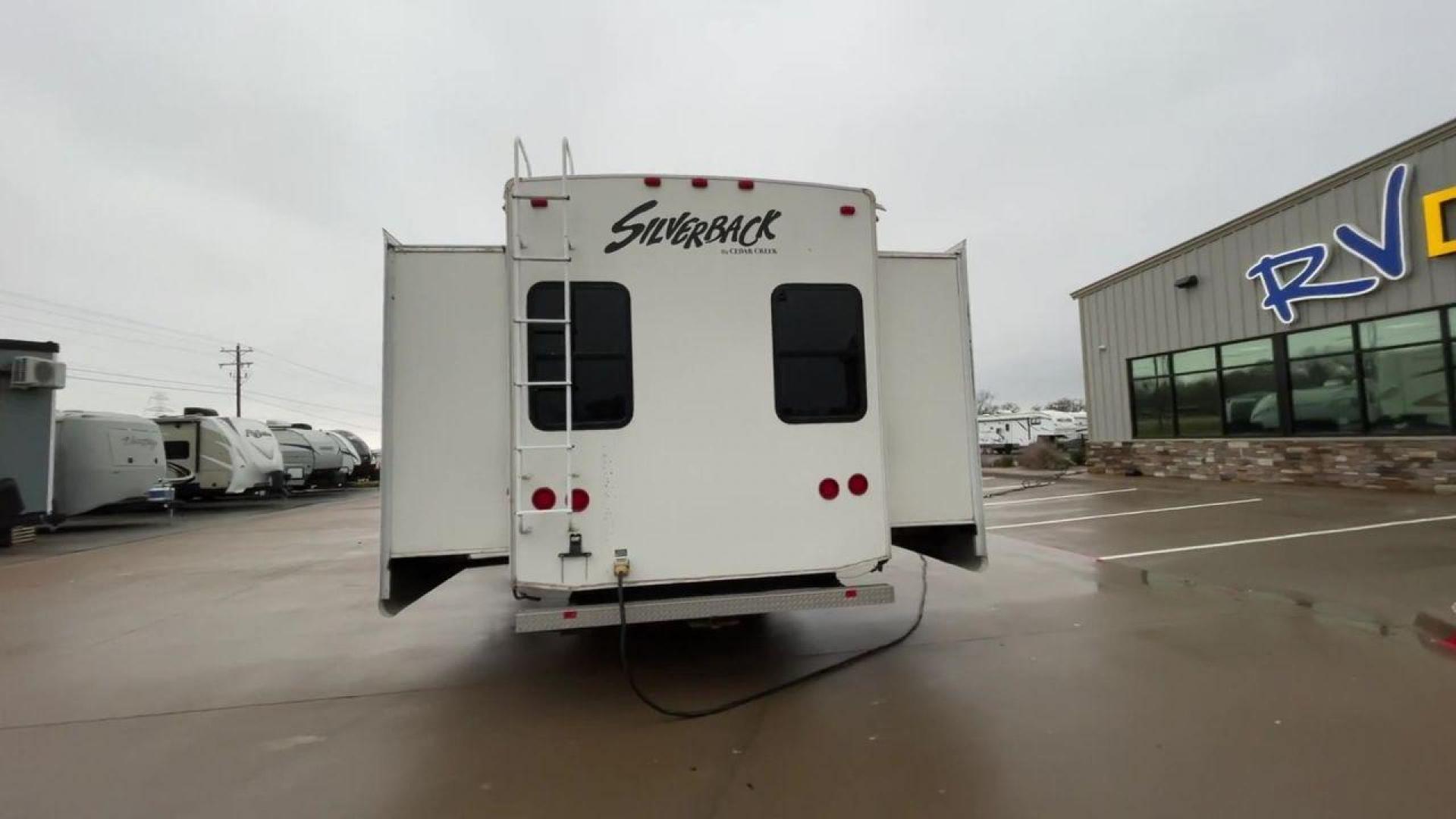 2010 WHITE CEDAR CREEK SILVERBA 35QB (4X4FCRL22AS) , Length: 41 ft.| Dry Weight: 12,184 lbs | Gross Weight: 15,500 lbs | Slides: 4 transmission, located at 4319 N Main Street, Cleburne, TX, 76033, (817) 221-0660, 32.435829, -97.384178 - With a length of 39 feet, the 35QB floor plan offers a private bunkhouse at the rear, ensuring a cozy retreat for the little ones or a group of friends. Its spacious living area with slide-outs expands the interior space for comfortable dining and entertainment. The kitchen is equipped with resident - Photo#8