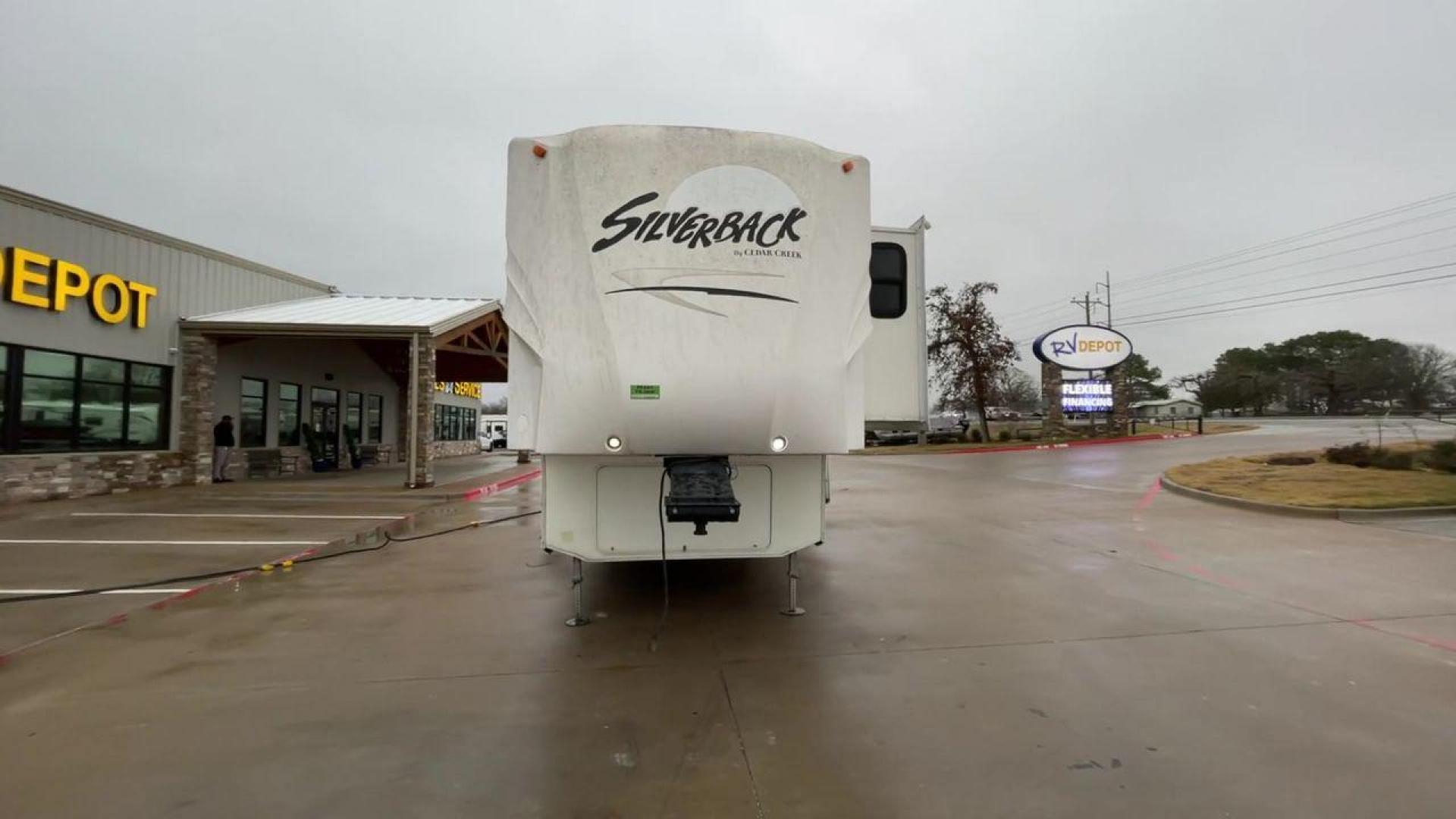 2010 WHITE CEDAR CREEK SILVERBA 35QB (4X4FCRL22AS) , Length: 41 ft.| Dry Weight: 12,184 lbs | Gross Weight: 15,500 lbs | Slides: 4 transmission, located at 4319 N Main Street, Cleburne, TX, 76033, (817) 221-0660, 32.435829, -97.384178 - With a length of 39 feet, the 35QB floor plan offers a private bunkhouse at the rear, ensuring a cozy retreat for the little ones or a group of friends. Its spacious living area with slide-outs expands the interior space for comfortable dining and entertainment. The kitchen is equipped with resident - Photo#4