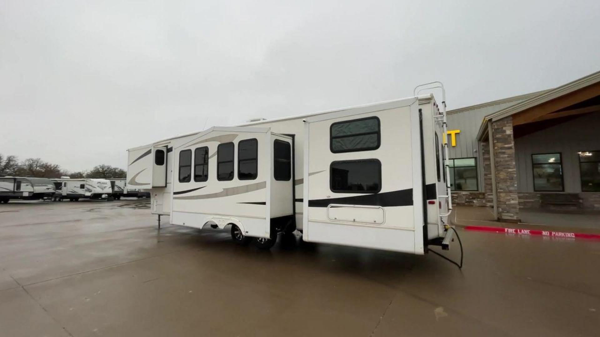 2010 WHITE CEDAR CREEK SILVERBA 35QB (4X4FCRL22AS) , Length: 41 ft.| Dry Weight: 12,184 lbs | Gross Weight: 15,500 lbs | Slides: 4 transmission, located at 4319 N Main Street, Cleburne, TX, 76033, (817) 221-0660, 32.435829, -97.384178 - With a length of 39 feet, the 35QB floor plan offers a private bunkhouse at the rear, ensuring a cozy retreat for the little ones or a group of friends. Its spacious living area with slide-outs expands the interior space for comfortable dining and entertainment. The kitchen is equipped with resident - Photo#7