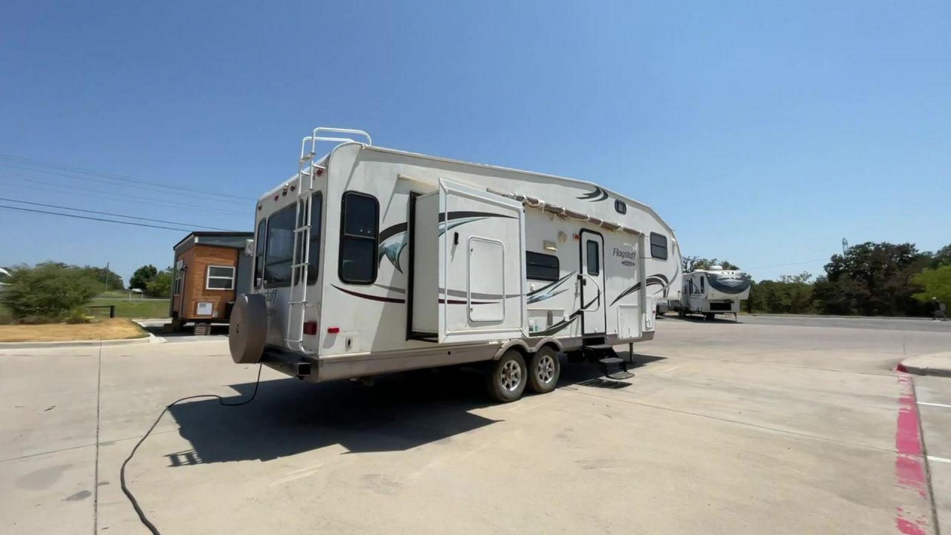 2010 WHITE FLAGSTAFF 8528CKSS - (4X4FFLD20A1) , Length: 30 ft. | Dry Weight: 6,877 lbs. | Slides: 2 transmission, located at 4319 N Main Street, Cleburne, TX, 76033, (817) 221-0660, 32.435829, -97.384178 - The 2010 Flagstaff 8528CKSS CT is a well-crafted and compact travel trailer designed for comfort and convenience on the road. With a length of 30 feet 11 inches, a width of 8 feet, and a height of 12 feet 7 inches, this trailer offers a balance of space and maneuverability. Its thoughtful constructi - Photo#1