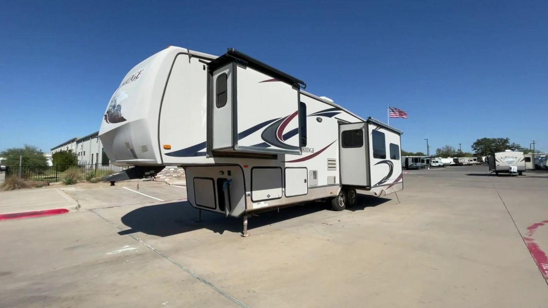 2011 TAN BLUE RIDGE 3125 (4X4FBLG22BG) , Length: 35.17 ft. | Dry Weight: 11,079 lbs. | Gross Weight: 13,975 lbs. | Slides: 3 transmission, located at 4319 N Main Street, Cleburne, TX, 76033, (817) 221-0660, 32.435829, -97.384178 - Discover the perfect blend of comfort and functionality with the 2011 Blue Ridge 3125. It is a meticulously designed fifth-wheel trailer crafted for unforgettable travel experiences. Extending to 35 feet, this model incorporates three slide-outs, ingeniously expanding the living space to create an i - Photo#0