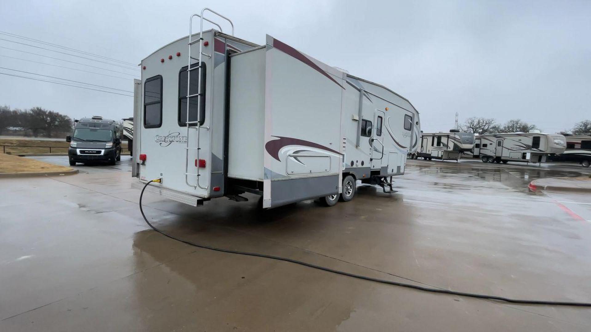 2011 GRAY GREYSTONE 33QB - (5SFSG3624BE) , Length: 36.8 ft. | Dry Weight: 11,466 lbs. | Gross Weight: 13,935 lbs. | Slides: 4 transmission, located at 4319 N Main Street, Cleburne, TX, 76033, (817) 221-0660, 32.435829, -97.384178 - Reasons to buy this RV include: (1) With four generous slide-outs, the interior space of this RV expands dramatically, providing ample room for relaxation and entertainment. (2) It features high-gloss fiberglass finish offers a sleek, modern aesthetic while providing a durable and low-maintenance - Photo#1