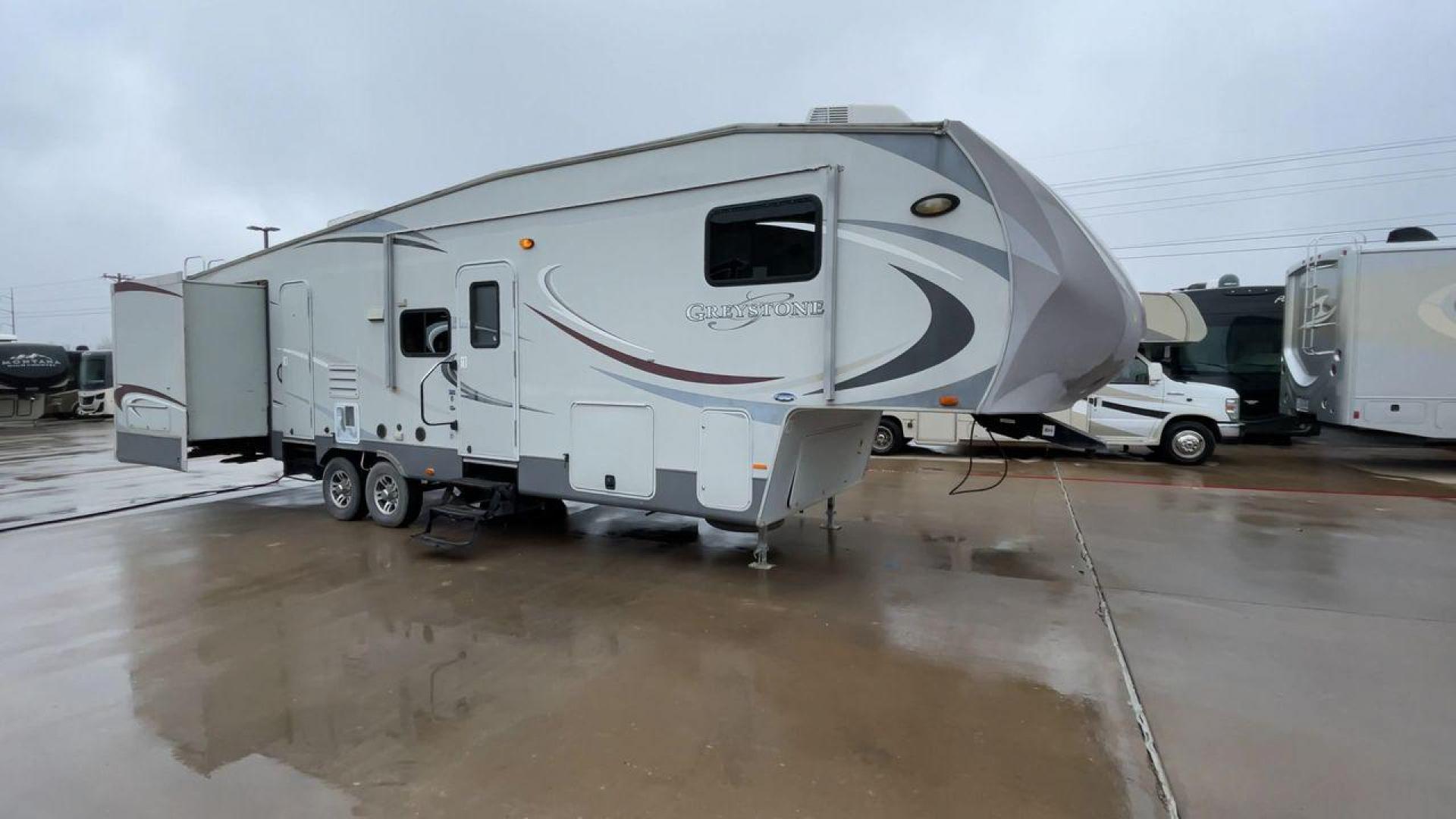 2011 GRAY GREYSTONE 33QB - (5SFSG3624BE) , Length: 36.8 ft. | Dry Weight: 11,466 lbs. | Gross Weight: 13,935 lbs. | Slides: 4 transmission, located at 4319 N Main Street, Cleburne, TX, 76033, (817) 221-0660, 32.435829, -97.384178 - Reasons to buy this RV include: (1) With four generous slide-outs, the interior space of this RV expands dramatically, providing ample room for relaxation and entertainment. (2) It features high-gloss fiberglass finish offers a sleek, modern aesthetic while providing a durable and low-maintenance - Photo#3