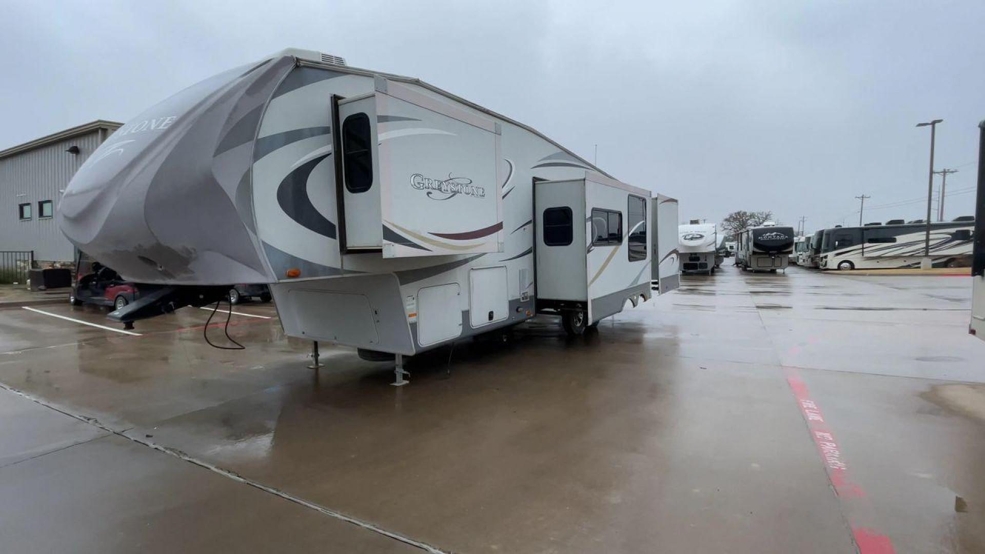 2011 GRAY GREYSTONE 33QB - (5SFSG3624BE) , Length: 36.8 ft. | Dry Weight: 11,466 lbs. | Gross Weight: 13,935 lbs. | Slides: 4 transmission, located at 4319 N Main Street, Cleburne, TX, 76033, (817) 221-0660, 32.435829, -97.384178 - Reasons to buy this RV include: (1) With four generous slide-outs, the interior space of this RV expands dramatically, providing ample room for relaxation and entertainment. (2) It features high-gloss fiberglass finish offers a sleek, modern aesthetic while providing a durable and low-maintenance - Photo#5