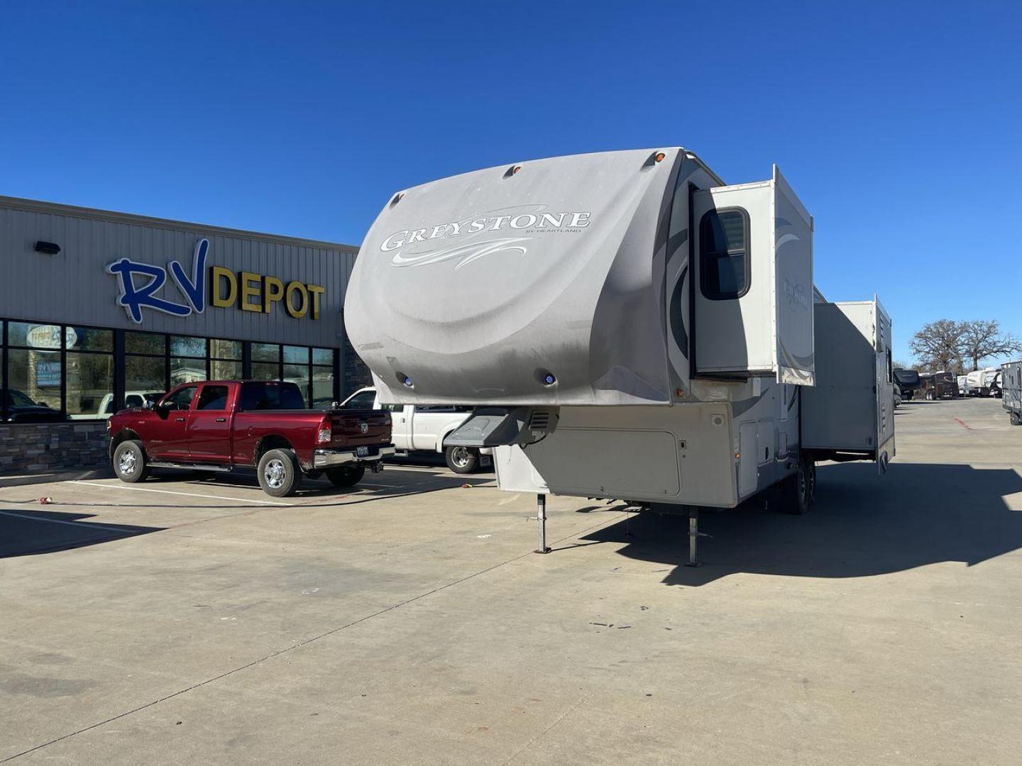 2011 WHITE HEARTLAND GREYSTONE 32RE (5SFSG3228BE) , Length: 34.83 ft. | Dry Weight: 10,421 lbs. | Gross Weight: 13,840 lbs. | Slides: 3 transmission, located at 4319 N Main Street, Cleburne, TX, 76033, (817) 221-0660, 32.435829, -97.384178 - This 2011 Heartland Greystone 32RE is a dual-axle aluminum wheel setup measuring nearly 35 feet long. It has a dry weight of 10,421 lbs. and a GVWR of 13,840 lbs. It includes three power slides as well as one 16-foot power awning. This unit features a classic rear living and front bedroom floor plan - Photo#0