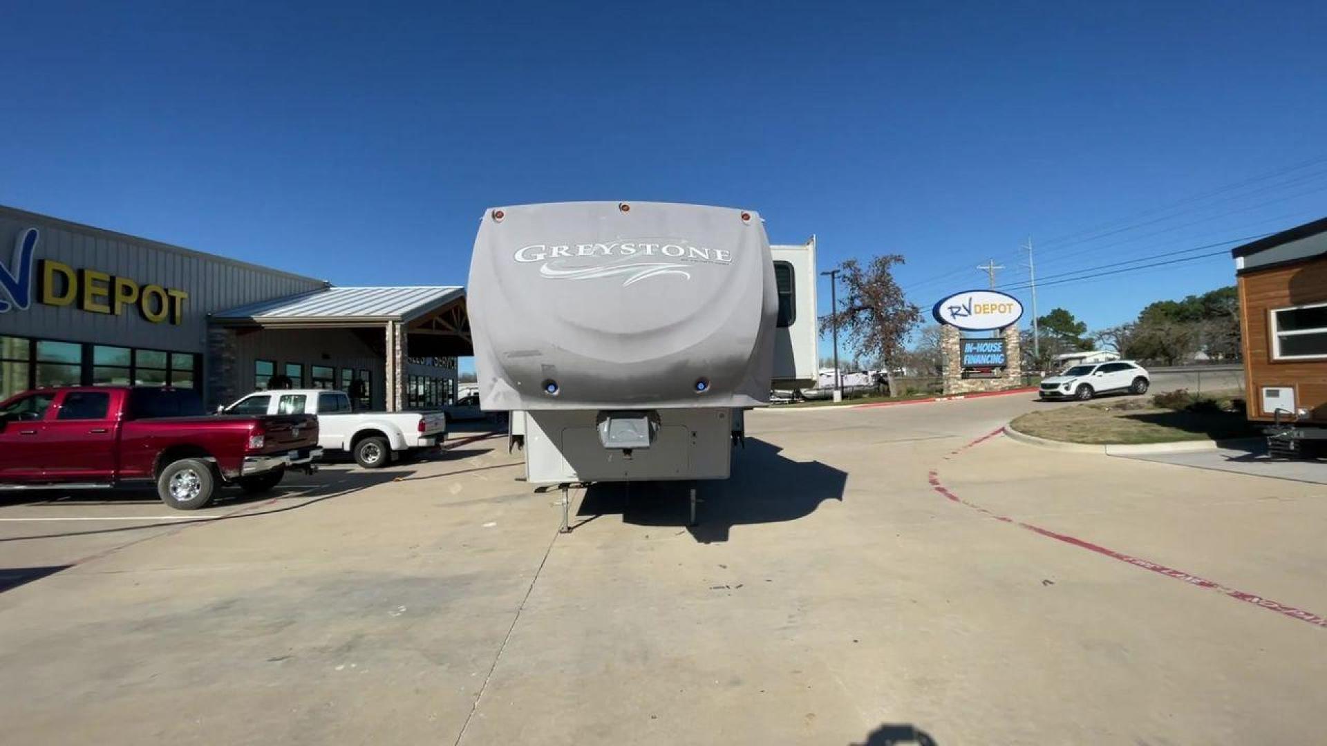 2011 WHITE HEARTLAND GREYSTONE 32RE (5SFSG3228BE) , Length: 34.83 ft. | Dry Weight: 10,421 lbs. | Gross Weight: 13,840 lbs. | Slides: 3 transmission, located at 4319 N Main Street, Cleburne, TX, 76033, (817) 221-0660, 32.435829, -97.384178 - This 2011 Heartland Greystone 32RE is a dual-axle aluminum wheel setup measuring nearly 35 feet long. It has a dry weight of 10,421 lbs. and a GVWR of 13,840 lbs. It includes three power slides as well as one 16-foot power awning. This unit features a classic rear living and front bedroom floor plan - Photo#4