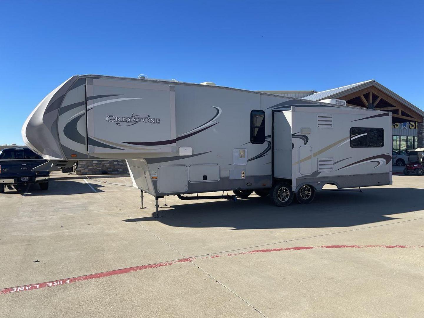 2011 WHITE HEARTLAND GREYSTONE 32RE (5SFSG3228BE) , Length: 34.83 ft. | Dry Weight: 10,421 lbs. | Gross Weight: 13,840 lbs. | Slides: 3 transmission, located at 4319 N Main Street, Cleburne, TX, 76033, (817) 221-0660, 32.435829, -97.384178 - This 2011 Heartland Greystone 32RE is a dual-axle aluminum wheel setup measuring nearly 35 feet long. It has a dry weight of 10,421 lbs. and a GVWR of 13,840 lbs. It includes three power slides as well as one 16-foot power awning. This unit features a classic rear living and front bedroom floor plan - Photo#22