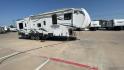 2011 WHITE HEARTLAND ROAD WARRIOR 305RW (5SFCG3021BE) , Length: 35.17 ft. | Dry Weight: 11,186 lbs. | Gross Weight: 14,000 lbs. | Slides: 2 transmission, located at 4319 N Main Street, Cleburne, TX, 76033, (817) 221-0660, 32.435829, -97.384178 - With a length of 35.17 ft. and a dry weight of 11,186 lbs, the 2011 Heartland Road Warrior 305RW offers a robust and stylish exterior, designed for both durability and convenience during travel. Its aerodynamic front cap enhances the overall look and performance on the road. The exterior features a - Photo#3