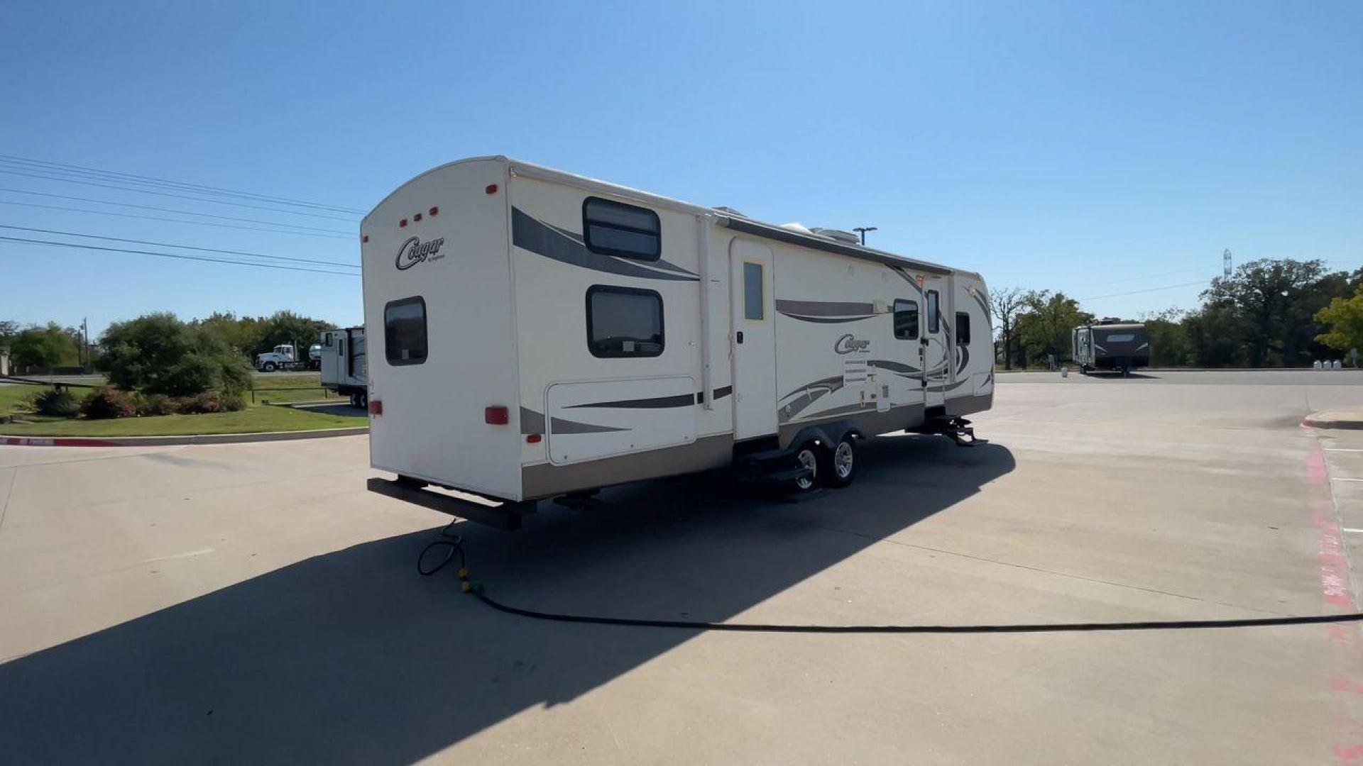 2011 KEYSTONE COUGAR 31SQB (4YDT31S20BV) , Length: 35.42 ft. | Dry Weight: 7,015 lbs. | Gross Weight: 9,000 lbs. | Slides: 2 transmission, located at 4319 N Main Street, Cleburne, TX, 76033, (817) 221-0660, 32.435829, -97.384178 - Photo#1