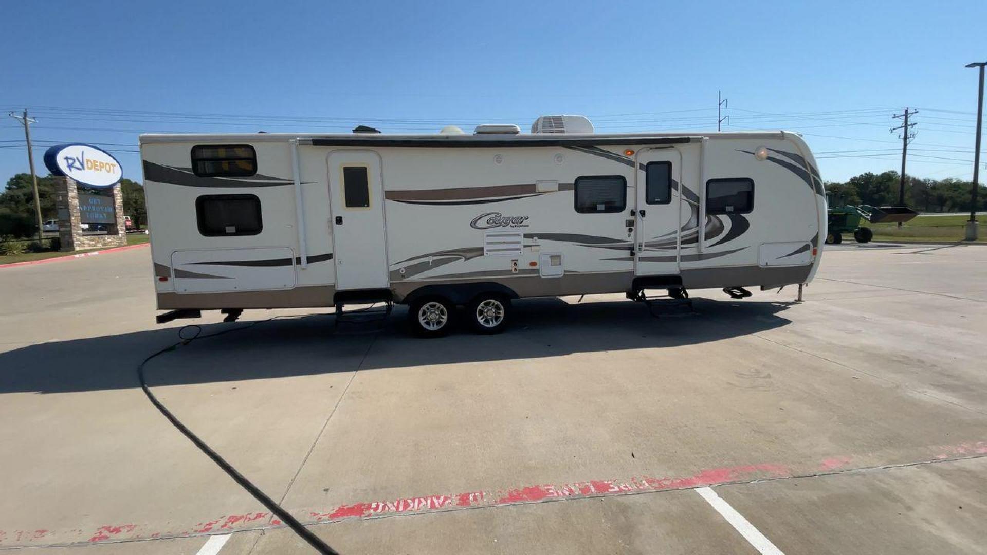 2011 KEYSTONE COUGAR 31SQB (4YDT31S20BV) , Length: 35.42 ft. | Dry Weight: 7,015 lbs. | Gross Weight: 9,000 lbs. | Slides: 2 transmission, located at 4319 N Main Street, Cleburne, TX, 76033, (817) 221-0660, 32.435829, -97.384178 - Photo#2