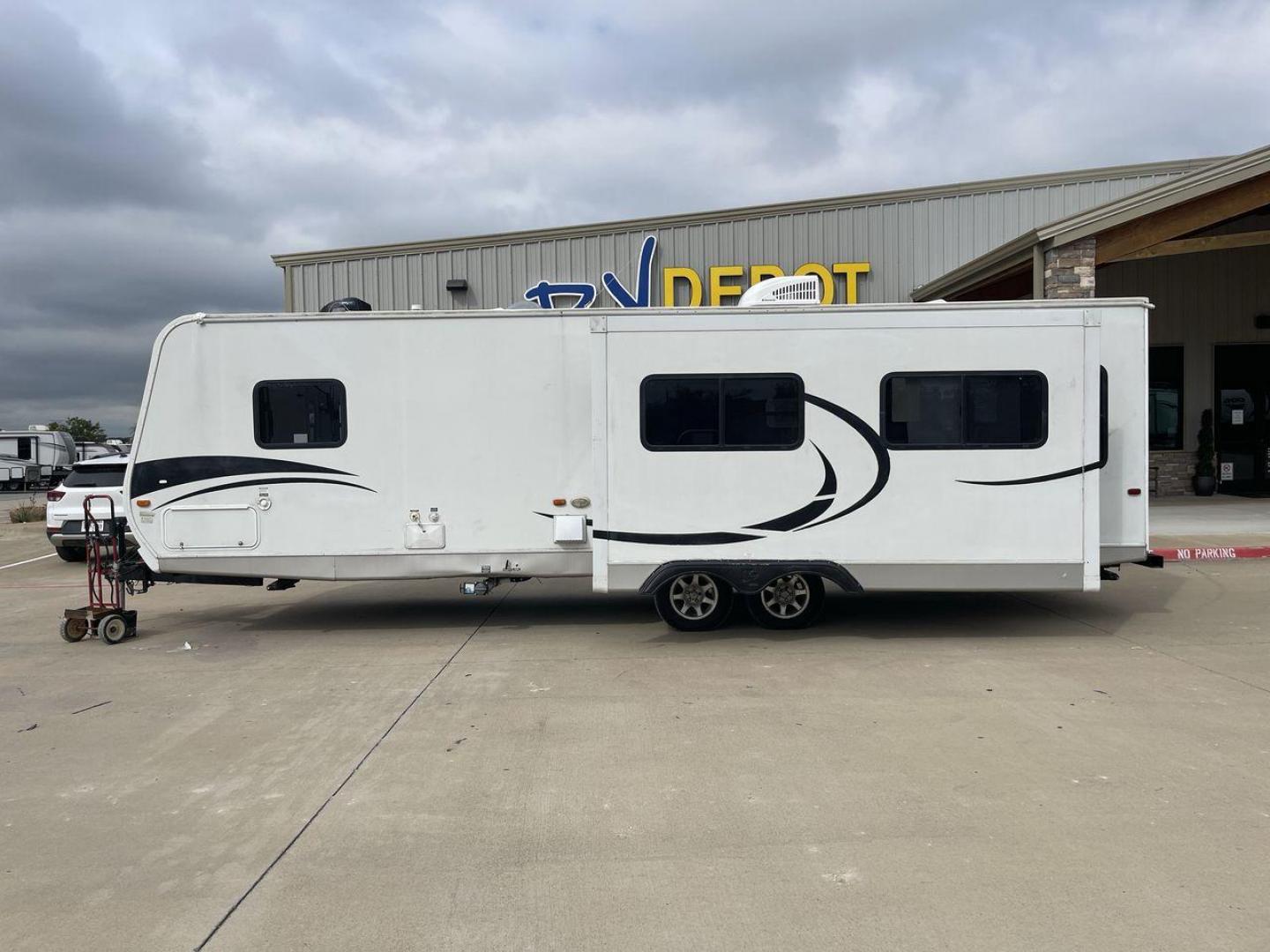 2011 KZ SPREE 323 RL (4EZTP3225B8) , located at 4319 N Main Street, Cleburne, TX, 76033, (817) 221-0660, 32.435829, -97.384178 - The 2011 KZSP CT features a clean and functional exterior design with practicality at its core. The white exterior is complemented by simple black graphic accents that stretch along the sides, providing a subtle yet stylish contrast. At the rear, the trailer includes a window for added natural light - Photo#24