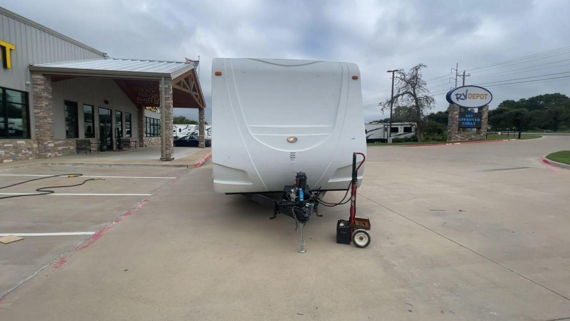 2011 KZ SPREE 323 RL (4EZTP3225B8) , located at 4319 N Main Street, Cleburne, TX, 76033, (817) 221-0660, 32.435829, -97.384178 - The 2011 KZSP CT features a clean and functional exterior design with practicality at its core. The white exterior is complemented by simple black graphic accents that stretch along the sides, providing a subtle yet stylish contrast. At the rear, the trailer includes a window for added natural light - Photo#4