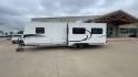 2011 KZ SPREE 323 RL (4EZTP3225B8) , located at 4319 N Main Street, Cleburne, TX, 76033, (817) 221-0660, 32.435829, -97.384178 - The 2011 KZSP CT features a clean and functional exterior design with practicality at its core. The white exterior is complemented by simple black graphic accents that stretch along the sides, providing a subtle yet stylish contrast. At the rear, the trailer includes a window for added natural light - Photo#6