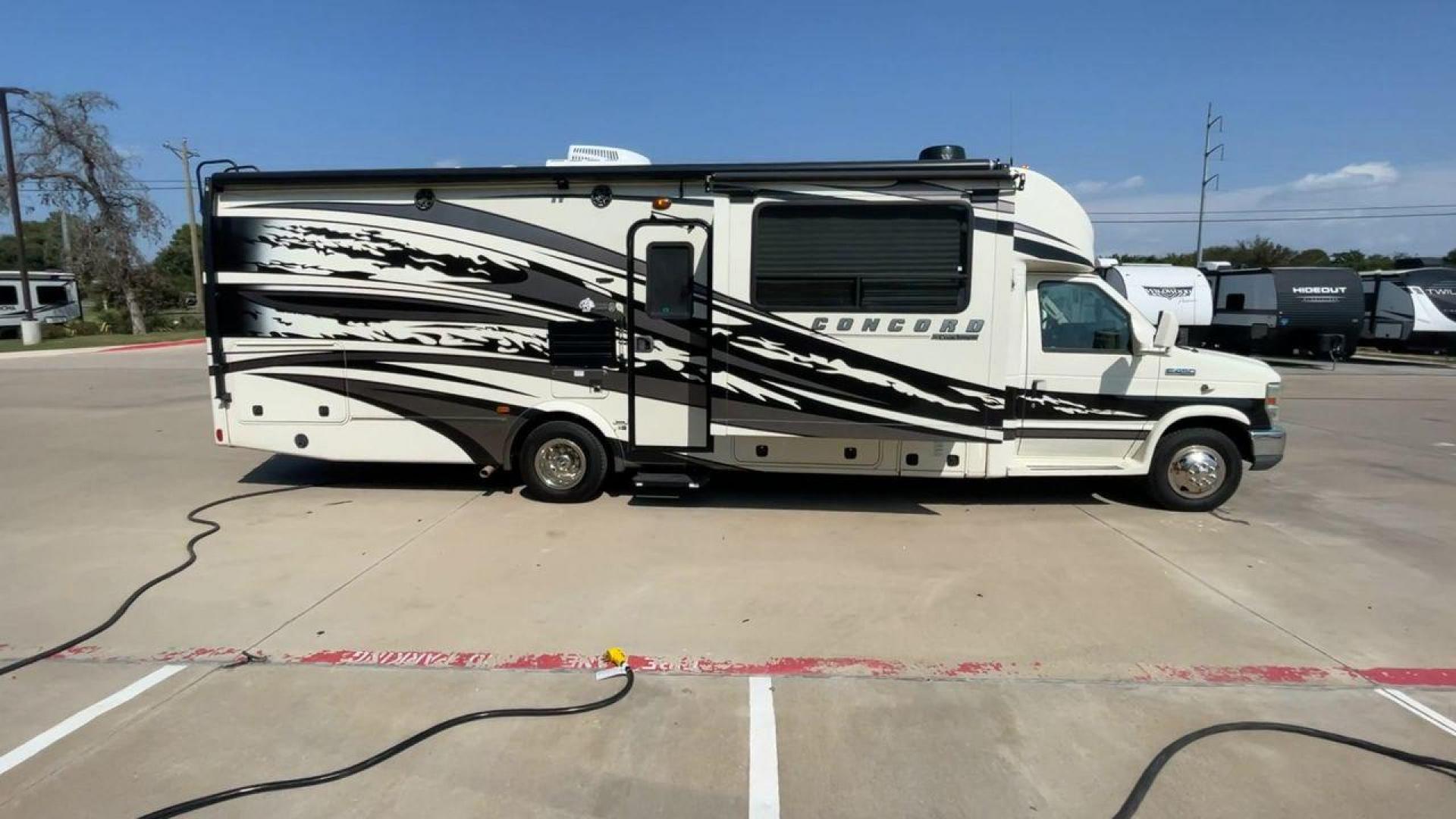 2012 WHITE COACHMEN CONCORD 300TS (1FDXE4FS9BD) , Length: 30.83 ft. | Dry Weight: 12,110 lbs. | Gross Weight: 14,500 lbs. | Slides: 3 transmission, located at 4319 N Main Street, Cleburne, TX, 76033, (817) 221-0660, 32.435829, -97.384178 - Photo#2