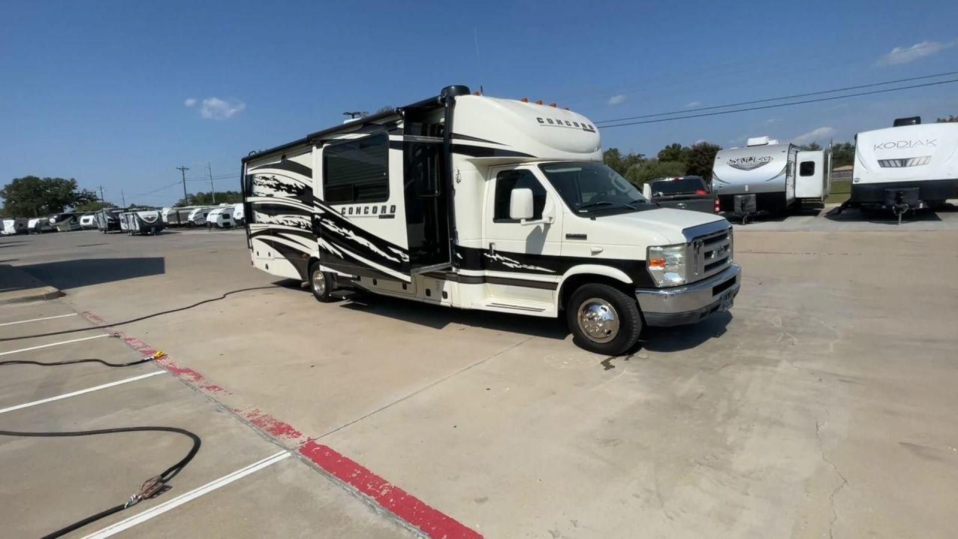 2012 WHITE COACHMEN CONCORD 300TS (1FDXE4FS9BD) , Length: 30.83 ft. | Dry Weight: 12,110 lbs. | Gross Weight: 14,500 lbs. | Slides: 3 transmission, located at 4319 N Main Street, Cleburne, TX, 76033, (817) 221-0660, 32.435829, -97.384178 - Photo#3