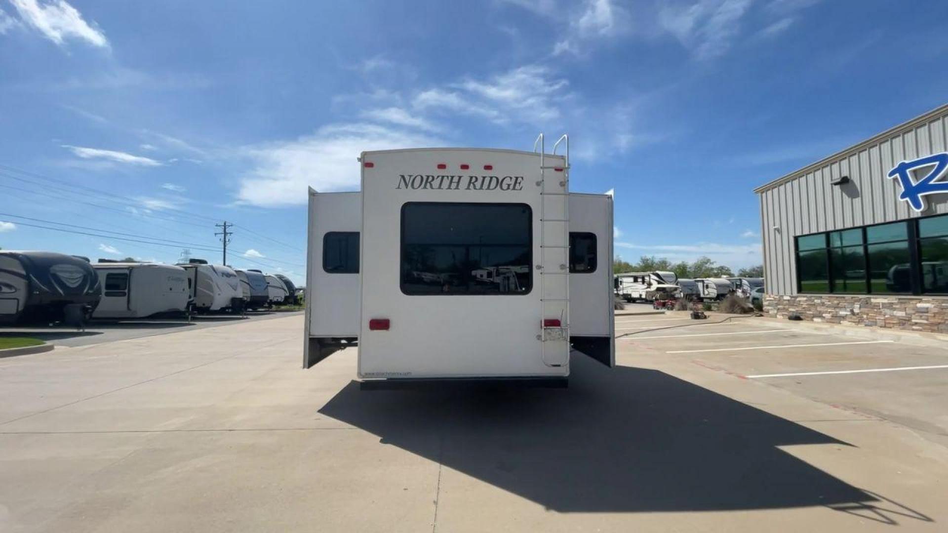 2012 COACHMEN NORTH RIDGE 320RLQ (5ZT3NRXB6CA) , Length: 37.17 ft. | Dry Weight: 10,405 lbs. | Gross Weight: 15,000 lbs. | Slides: 4 transmission, located at 4319 N Main Street, Cleburne, TX, 76033, (817) 221-0660, 32.435829, -97.384178 - The 2012 Coachmen North Ridge 320RLQ is a 37-foot fifth wheel with four slides and an aluminum frame. With the quadruple slides, space and storage will never be an issue! The unit also comes with automatic heating and cooling rated at 40,000 and 15,000 BTUs, respectively. The interior has beautiful - Photo#8