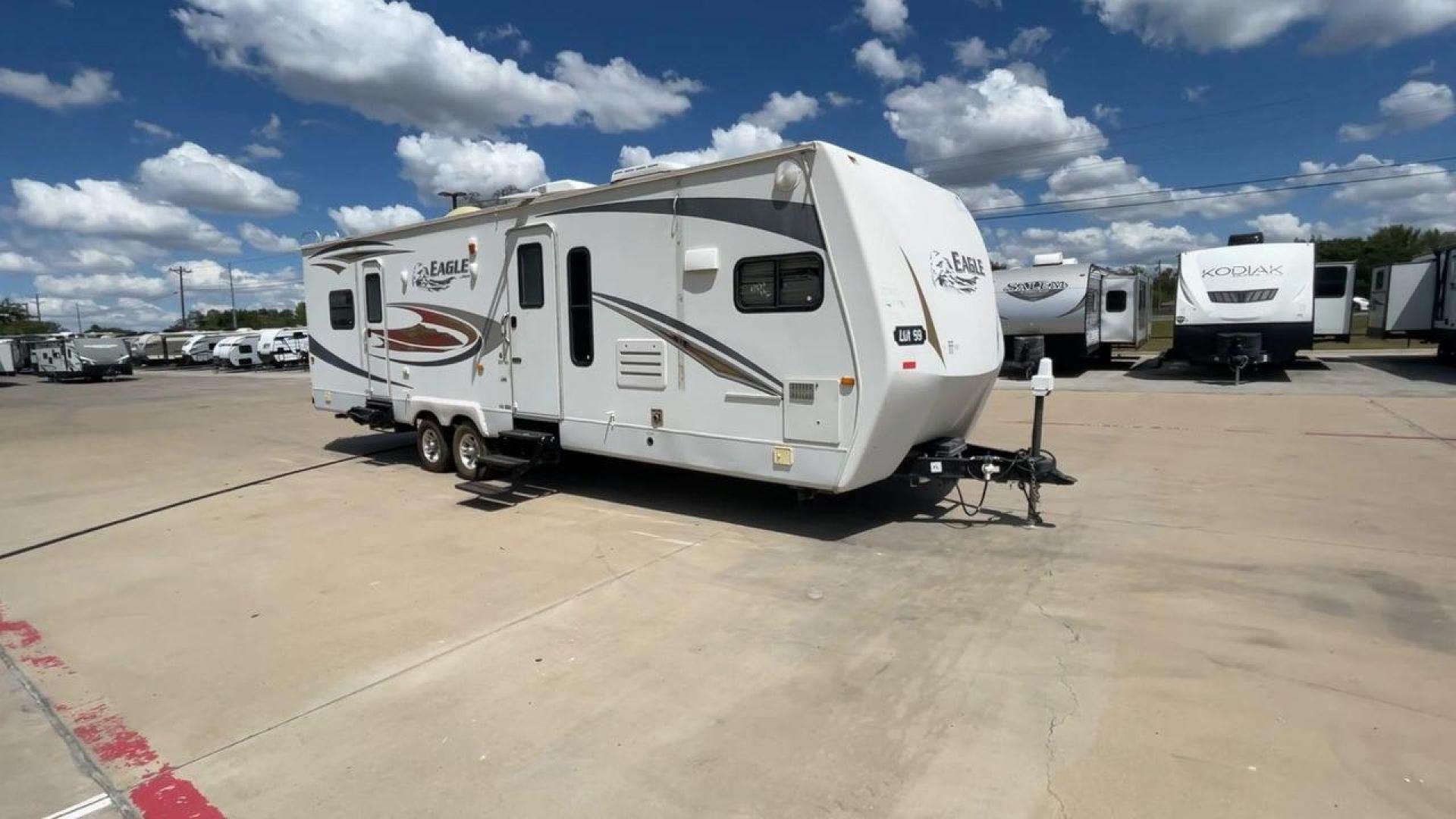 2012 WHITE JAYCO EAGLE 322FKS (1UJBJ0BR3C1) , Length: 33.92 ft. | Dry Weight: 7,835 lbs. | Gross Weight: 10,250 lbs. | Slides: 2 transmission, located at 4319 N Main Street, Cleburne, TX, 76033, (817) 221-0660, 32.435829, -97.384178 - The 2012 Jayco Eagle 322FKS is a dual-axle aluminum wheel set-up that measures 33.92 ft. in length. It has a dry weight of 7,835 lbs. and a GVWR of 10,250 lbs. Its exterior is a base color of white with gray, black and gold accents. This trailer has 2 slides. This Jayco has a rear bedroom, front - Photo#3