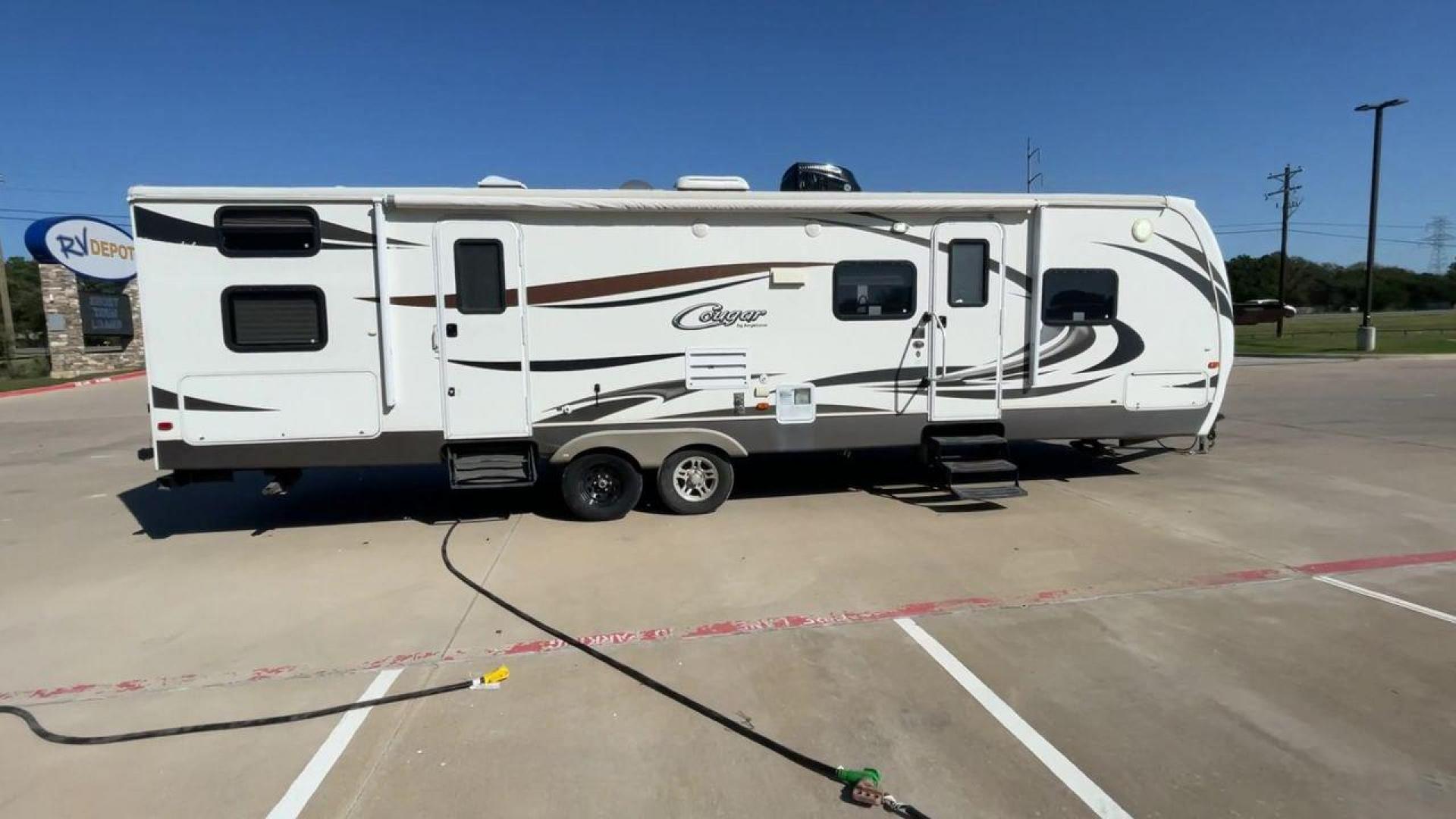 2012 KEYSTONE COUGAR 31SQB (4YDT31S28CW) , Length: 35.92 ft. | Dry Weight: 7,169 lbs. | Gross Weight: 9,000 lbs. | Slides: 2 transmission, located at 4319 N Main Street, Cleburne, TX, 76033, (817) 221-0660, 32.435829, -97.384178 - Experience the perfect blend of comfort, style, and functionality with the 2012 Keystone Cougar 31SQB. With a length of 35.92 ft., this RV is designed to provide your family with a home away from home. This unit ensures that you and your family have plenty of room to relax and enjoy your travels. Th - Photo#2