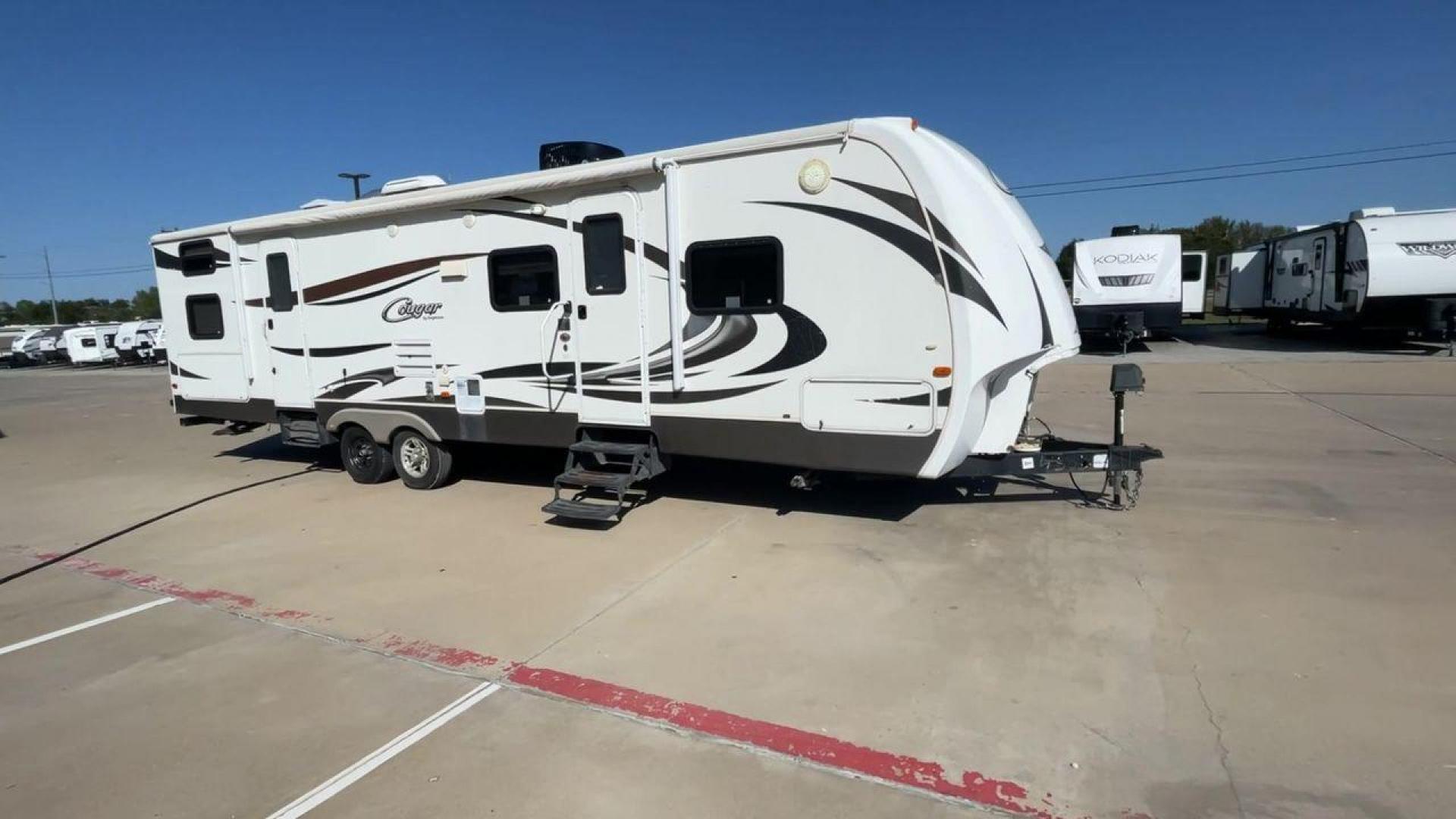 2012 KEYSTONE COUGAR 31SQB (4YDT31S28CW) , Length: 35.92 ft. | Dry Weight: 7,169 lbs. | Gross Weight: 9,000 lbs. | Slides: 2 transmission, located at 4319 N Main Street, Cleburne, TX, 76033, (817) 221-0660, 32.435829, -97.384178 - Experience the perfect blend of comfort, style, and functionality with the 2012 Keystone Cougar 31SQB. With a length of 35.92 ft., this RV is designed to provide your family with a home away from home. This unit ensures that you and your family have plenty of room to relax and enjoy your travels. Th - Photo#3