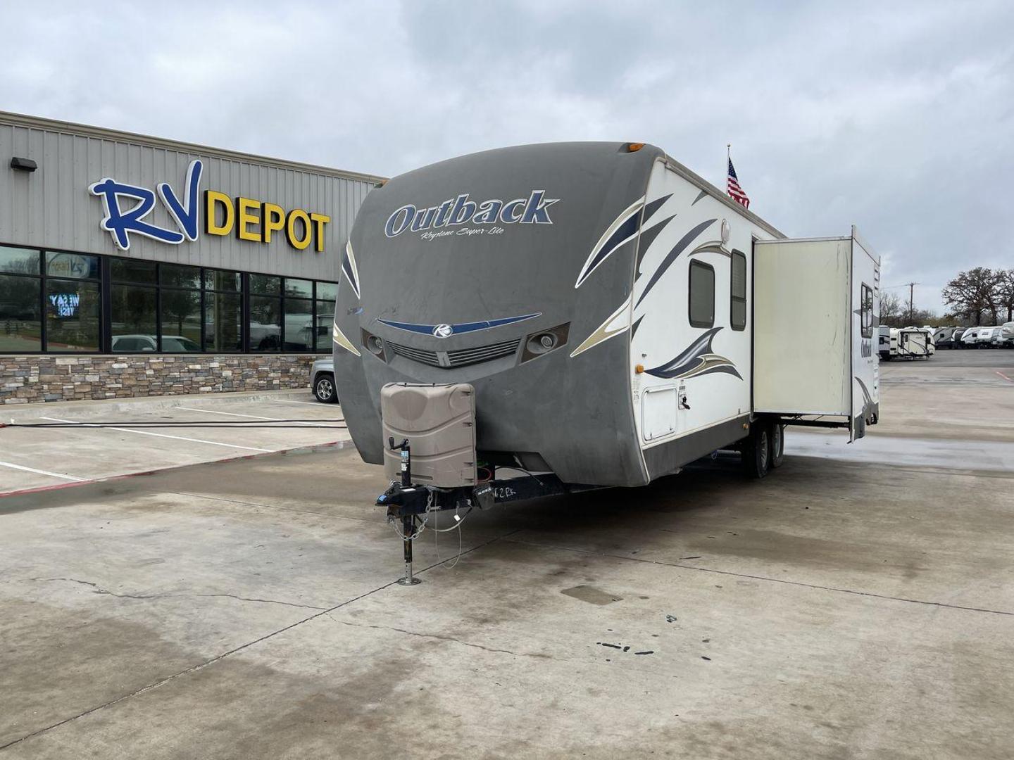 2012 WHITE KEYSTONE OUTBACK 272RK (4YDT27227CB) , Length: 30.33 ft. | Dry Weight: 5,976 lbs. | Gross Weight: 7,800 lbs. | Slides: 1 transmission, located at 4319 N Main Street, Cleburne, TX, 76033, (817) 221-0660, 32.435829, -97.384178 - Explore more reasons that emphasize the benefits of having this RV as your own. (1) Navigate campsites and winding roads with ease thanks to the single-axle design and 30' 4"" length. (2) Built to withstand the elements, the Outback is ready for all your outdoor adventures. (3) Keep clothes and - Photo#0