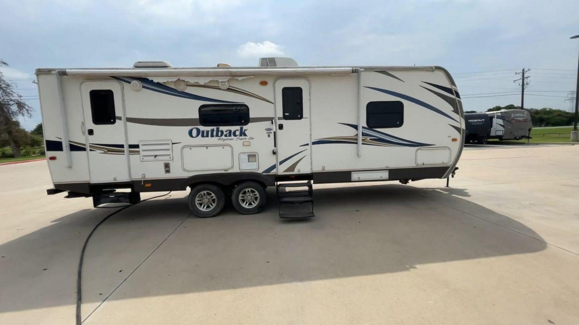 2012 KEYSTONE RV OUTBACK 274RB (4YDT27420CB) , Length: 30.33 ft | Dry Weight: 5,995 lbs. | Gross Weight: 7,800 lbs. | Slides: 1 transmission, located at 4319 N Main Street, Cleburne, TX, 76033, (817) 221-0660, 32.435829, -97.384178 - Experience the 2012 Keystone RV Outback 274RB Travel Trailer, the ideal fusion of adventure and comfort. This well-built travel trailer is a great option for any family or couple looking for a roomy and fashionable mobile home. The dimensions of this unit are 30.33 ft in length, 8 ft in width, an - Photo#2