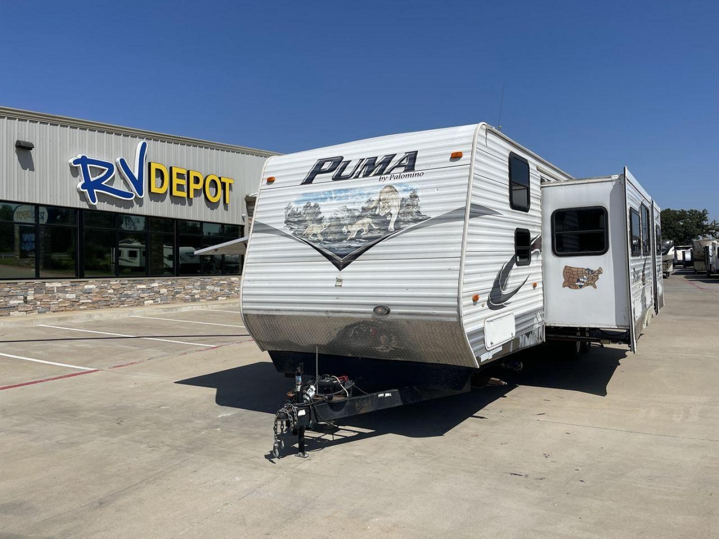 2012 WHITE PUMA 30KFB (4X4TPUF27CP) , Length: 34.75 ft. | Dry Weight: 8,130 lbs. | Gross Weight: 11,315 lbs. | Slides: 2 transmission, located at 4319 N Main Street, Cleburne, TX, 76033, (817) 221-0660, 32.435829, -97.384178 - The 2012 Puma 30KFB travel trailer has 34.75 ft length, 8 ft width, 11.08 ft height, and 6.67 ft interior height. The dry weight of this unit is about 8,130 lbs, with a payload capacity of 3,125 lbs. It has a GVWR of 11,315 lbs and a hitch weight of 1,155 lbs. This unit highlights an outdoor fro - Photo#0