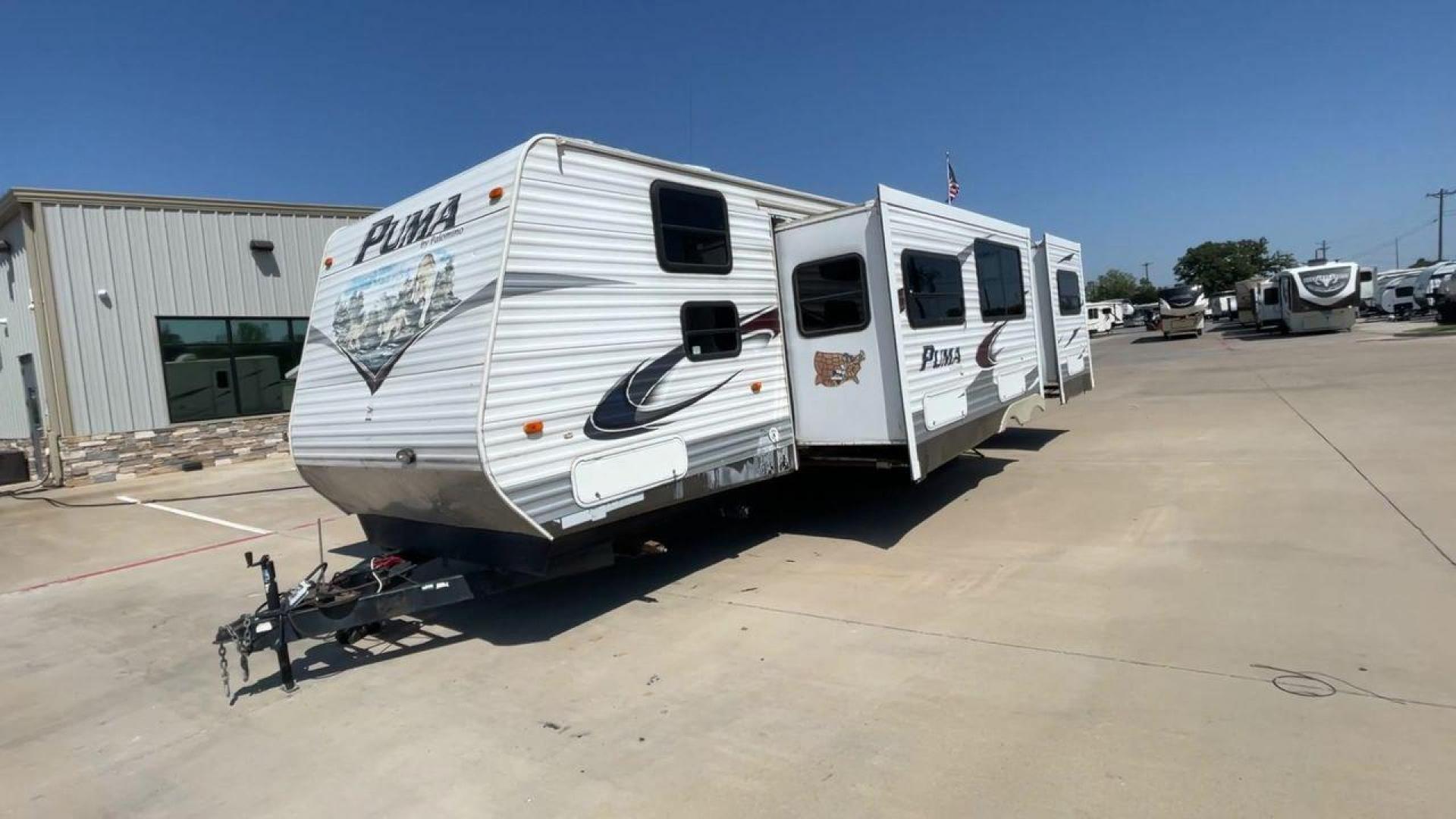 2012 WHITE PUMA 30KFB (4X4TPUF27CP) , Length: 34.75 ft. | Dry Weight: 8,130 lbs. | Gross Weight: 11,315 lbs. | Slides: 2 transmission, located at 4319 N Main Street, Cleburne, TX, 76033, (817) 221-0660, 32.435829, -97.384178 - The 2012 Puma 30KFB travel trailer has 34.75 ft length, 8 ft width, 11.08 ft height, and 6.67 ft interior height. The dry weight of this unit is about 8,130 lbs, with a payload capacity of 3,125 lbs. It has a GVWR of 11,315 lbs and a hitch weight of 1,155 lbs. This unit highlights an outdoor fro - Photo#5