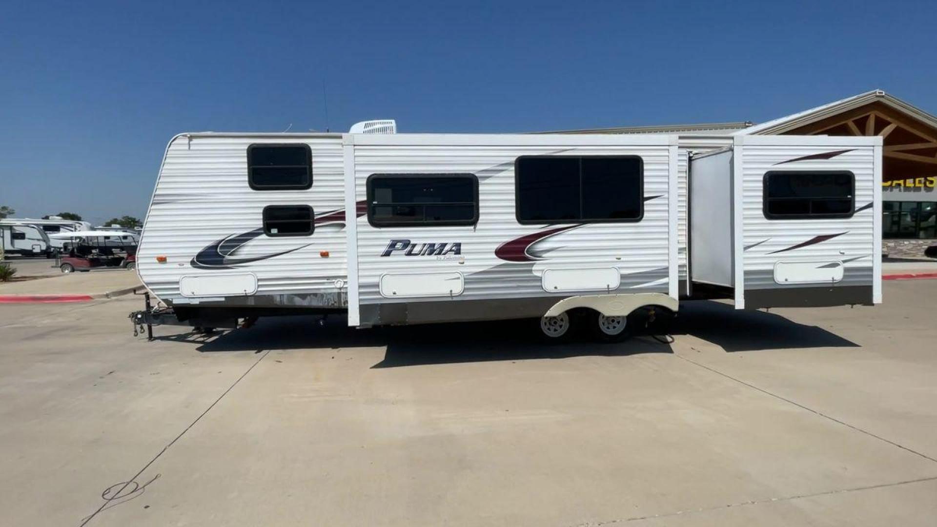 2012 WHITE PUMA 30KFB (4X4TPUF27CP) , Length: 34.75 ft. | Dry Weight: 8,130 lbs. | Gross Weight: 11,315 lbs. | Slides: 2 transmission, located at 4319 N Main Street, Cleburne, TX, 76033, (817) 221-0660, 32.435829, -97.384178 - The 2012 Puma 30KFB travel trailer has 34.75 ft length, 8 ft width, 11.08 ft height, and 6.67 ft interior height. The dry weight of this unit is about 8,130 lbs, with a payload capacity of 3,125 lbs. It has a GVWR of 11,315 lbs and a hitch weight of 1,155 lbs. This unit highlights an outdoor fro - Photo#6