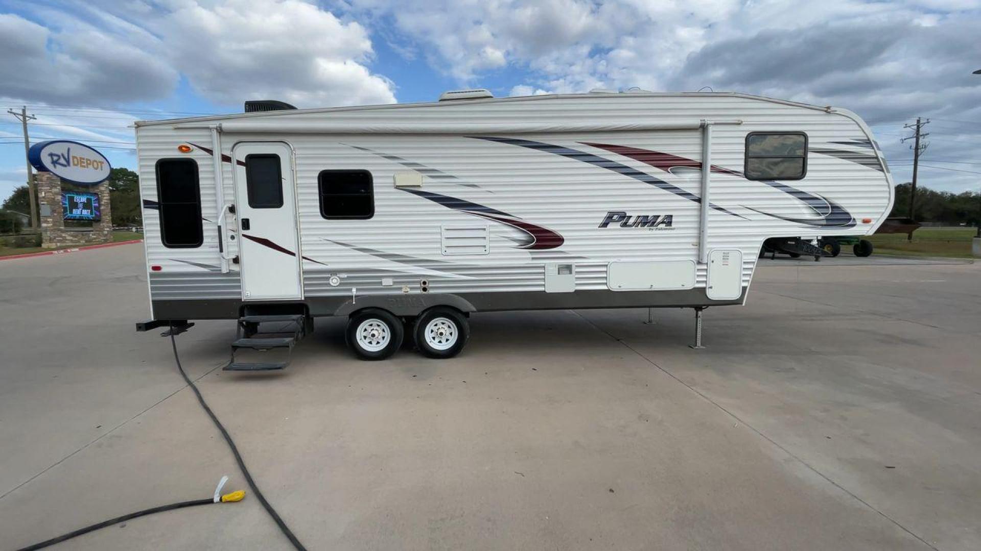 2013 FOREST RIVER PUMA 276RLSS (4X4FPAD29DP) , Length: 30.17 ft. | Dry Weight: 7,451 lbs. | Gross Weight: 10,273 lbs. | Slides: 1 transmission, located at 4319 N Main Street, Cleburne, TX, 76033, (817) 221-0660, 32.435829, -97.384178 - Photo#2