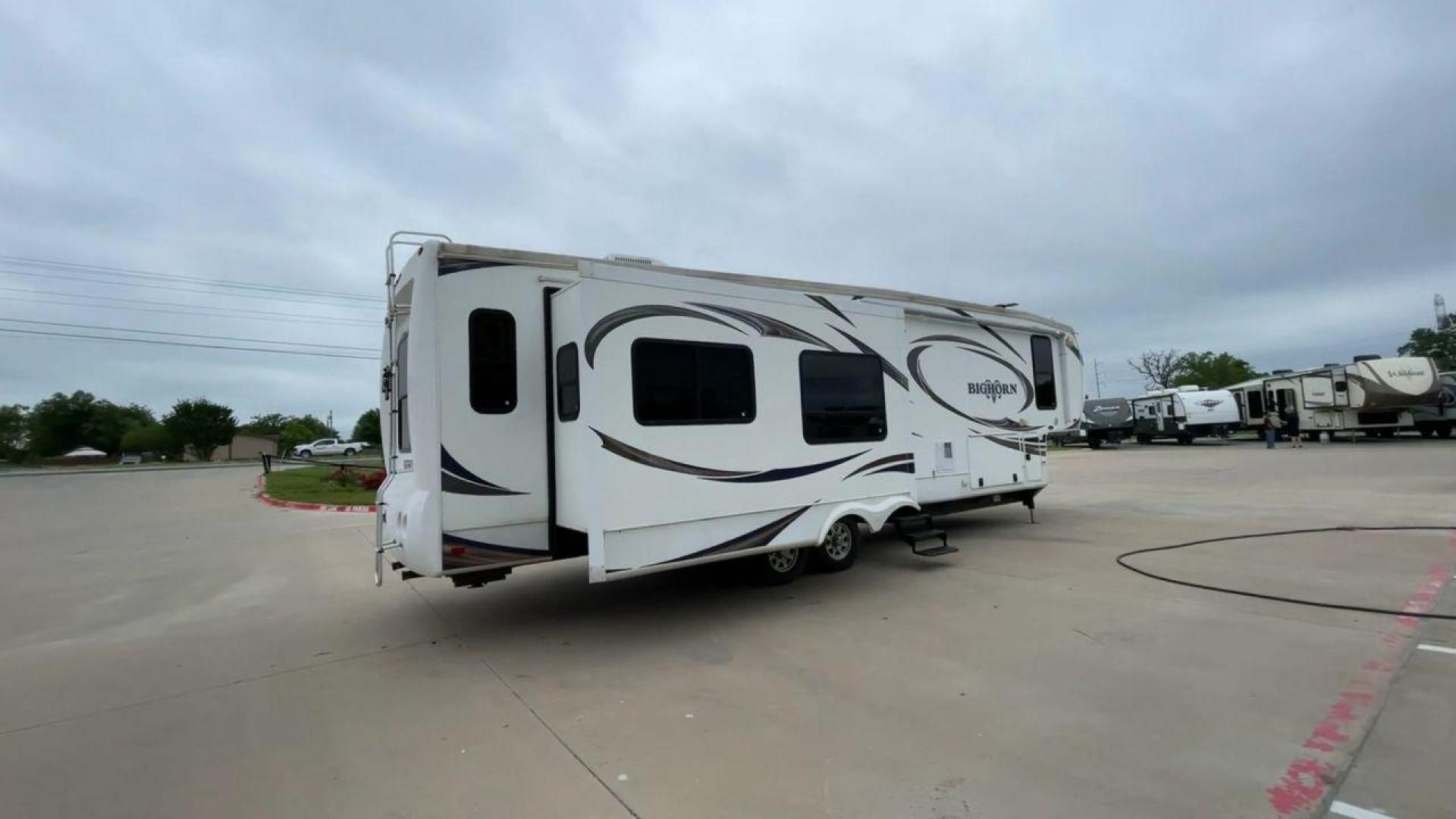 2013 WHITE HEARTLAND BIGHORN 3585RL - (5SFBG3826DE) , Length: 38.25 ft. | Dry Weight: 12,018 lbs. | Gross Weight: 15,500 lbs. | Slides: 3 transmission, located at 4319 N Main Street, Cleburne, TX, 76033, (817) 221-0660, 32.435829, -97.384178 - The 2013 Heartland Big Horn 3585RL is a triple-slide fifth wheel measuring 38.25 ft. in length and crafted with aluminum and fiberglass, ensuring durability and longevity. With a dry weight of 12,018 lbs. and a GVWR of 15,500 lbs., this impressive model offers both practicality and versatility. The - Photo#1