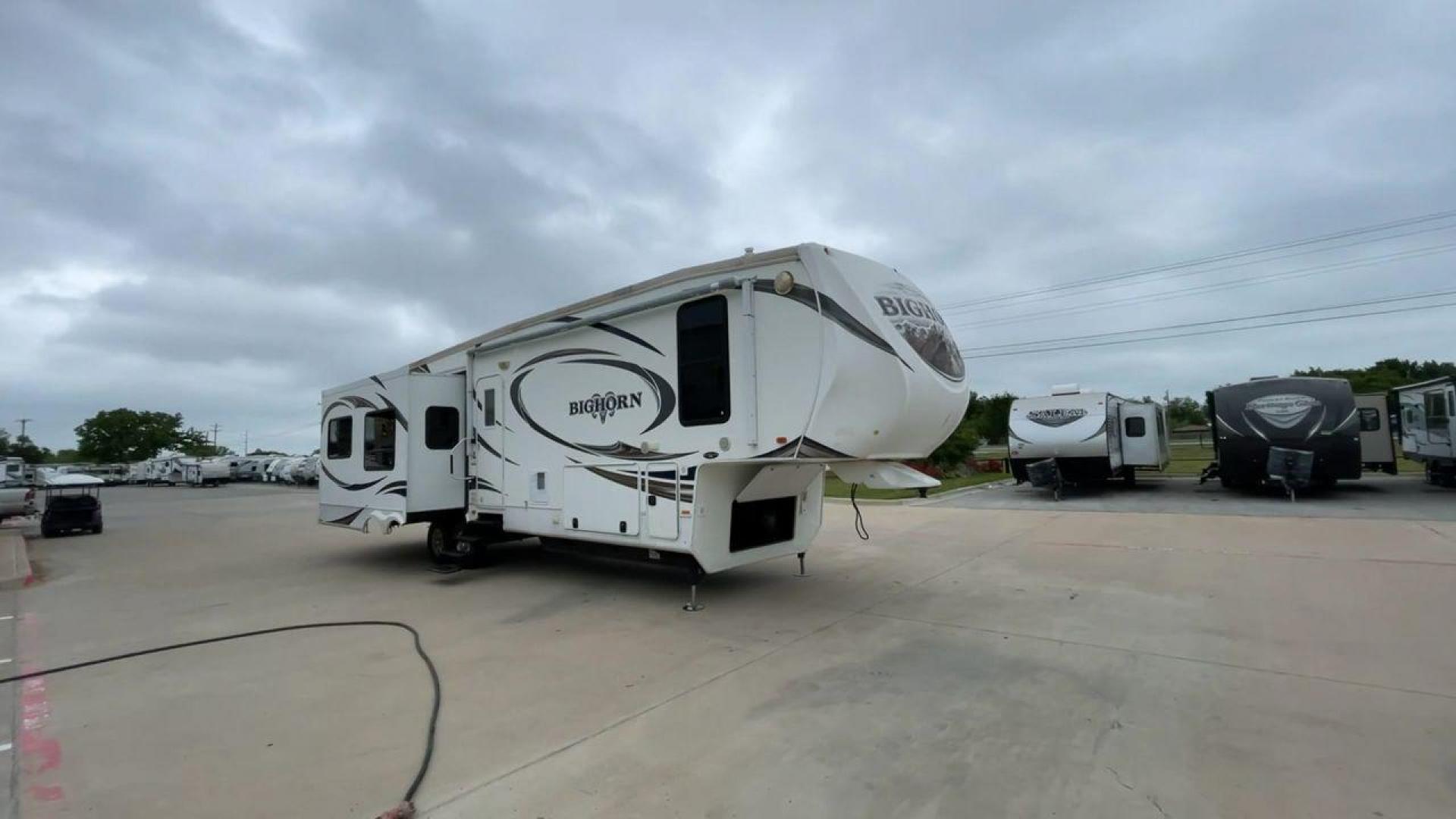 2013 WHITE HEARTLAND BIGHORN 3585RL - (5SFBG3826DE) , Length: 38.25 ft. | Dry Weight: 12,018 lbs. | Gross Weight: 15,500 lbs. | Slides: 3 transmission, located at 4319 N Main Street, Cleburne, TX, 76033, (817) 221-0660, 32.435829, -97.384178 - The 2013 Heartland Big Horn 3585RL is a triple-slide fifth wheel measuring 38.25 ft. in length and crafted with aluminum and fiberglass, ensuring durability and longevity. With a dry weight of 12,018 lbs. and a GVWR of 15,500 lbs., this impressive model offers both practicality and versatility. The - Photo#3