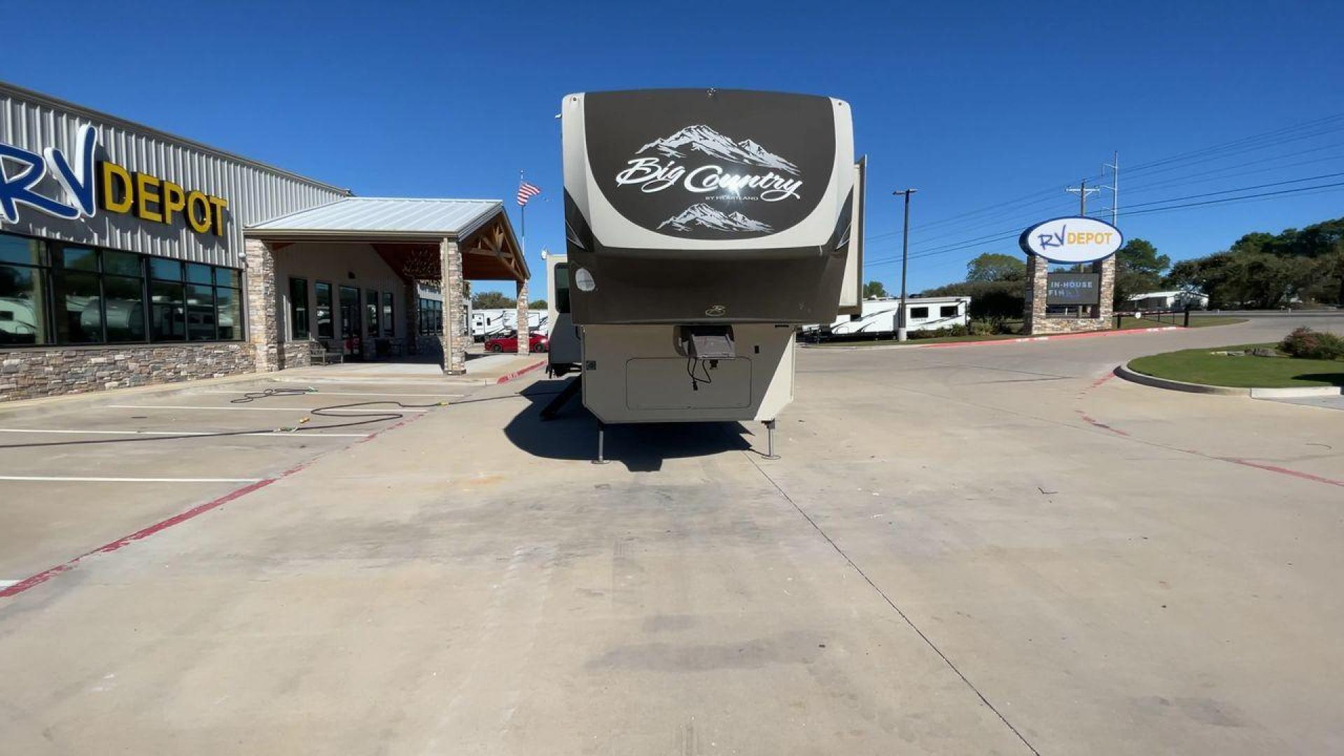 2013 HEARTLAND BIG COUNTRY 3251TS (5SFBG3423DE) , Length: 37.92 ft. | Dry Weight: 10,999 lbs. | Gross Weight: 14,000 lbs. | Slides: 3 transmission, located at 4319 N Main Street, Cleburne, TX, 76033, (817) 221-0660, 32.435829, -97.384178 - This 2013 Heartland Big Country 3251TS fifth wheel measures 37.92 feet. There are two axles with aluminum wheels and hydraulic drum brakes. Its dry weight is 10,999 lbs; its payload is 3,410 lbs, its hitch is 1,920 lbs and the GVWR 14,000 lbs. The fiberglass walls are painted tan with gray and blue - Photo#4