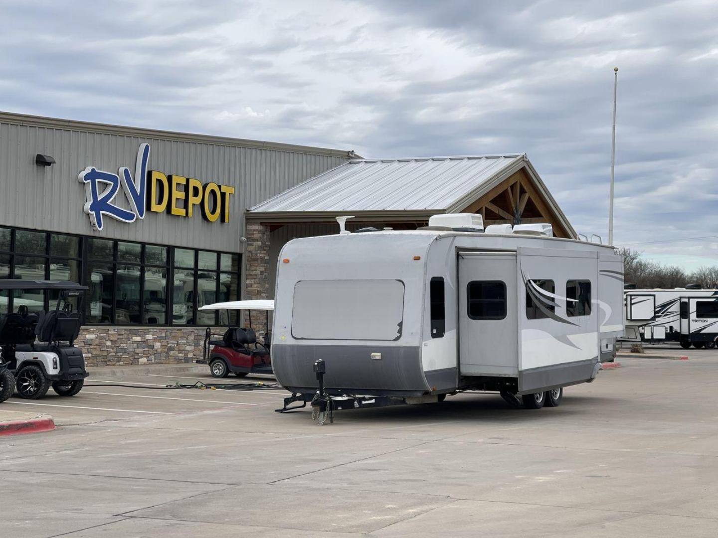 2013 GRAY HEARTLAND OPEN RANGE 288FLR - (5XMTL3726D2) , Length: 33.5 ft | Dry Weight: 7,480 lbs. | Gross Weight: 9,800 lbs. | Slides: 3 transmission, located at 4319 N Main Street, Cleburne, TX, 76033, (817) 221-0660, 32.435829, -97.384178 - The 2013 Heartland Open Range 288FLR focuses on spacious living and thoughtful design. This travel trailer offers a luxurious home on wheels for those seeking both comfort and adventure. Step into the RV and be welcomed by the innovative front living room layout. This unique design features a spacio - Photo#0