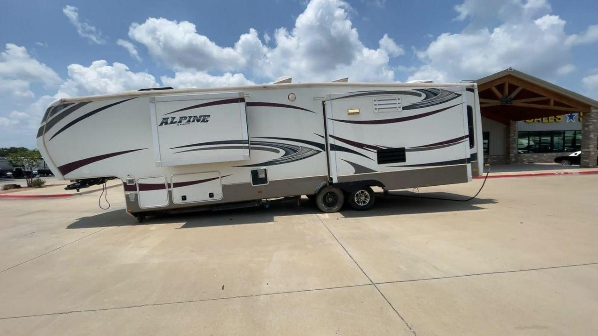 2013 WHITE KEYSTONE ALPNE 3720FB - (4YDF37227DE) , Length: 39.42 ft. | Dry Weight: 12,457 lbs. | Gross Weight: 15,500 lbs. | Slides: 4 transmission, located at 4319 N Main Street, Cleburne, TX, 76033, (817) 221-0660, 32.435829, -97.384178 - The 2013 Keystone Alpine 3720FB Travel Trailer provides a luxurious camping experience. This trailer is 39.42 feet long and has a dry weight of 12,457 lbs., providing plenty of space for relaxation and entertainment. Featuring four slides and convenient rear roof access, this RV offers ample space f - Photo#6