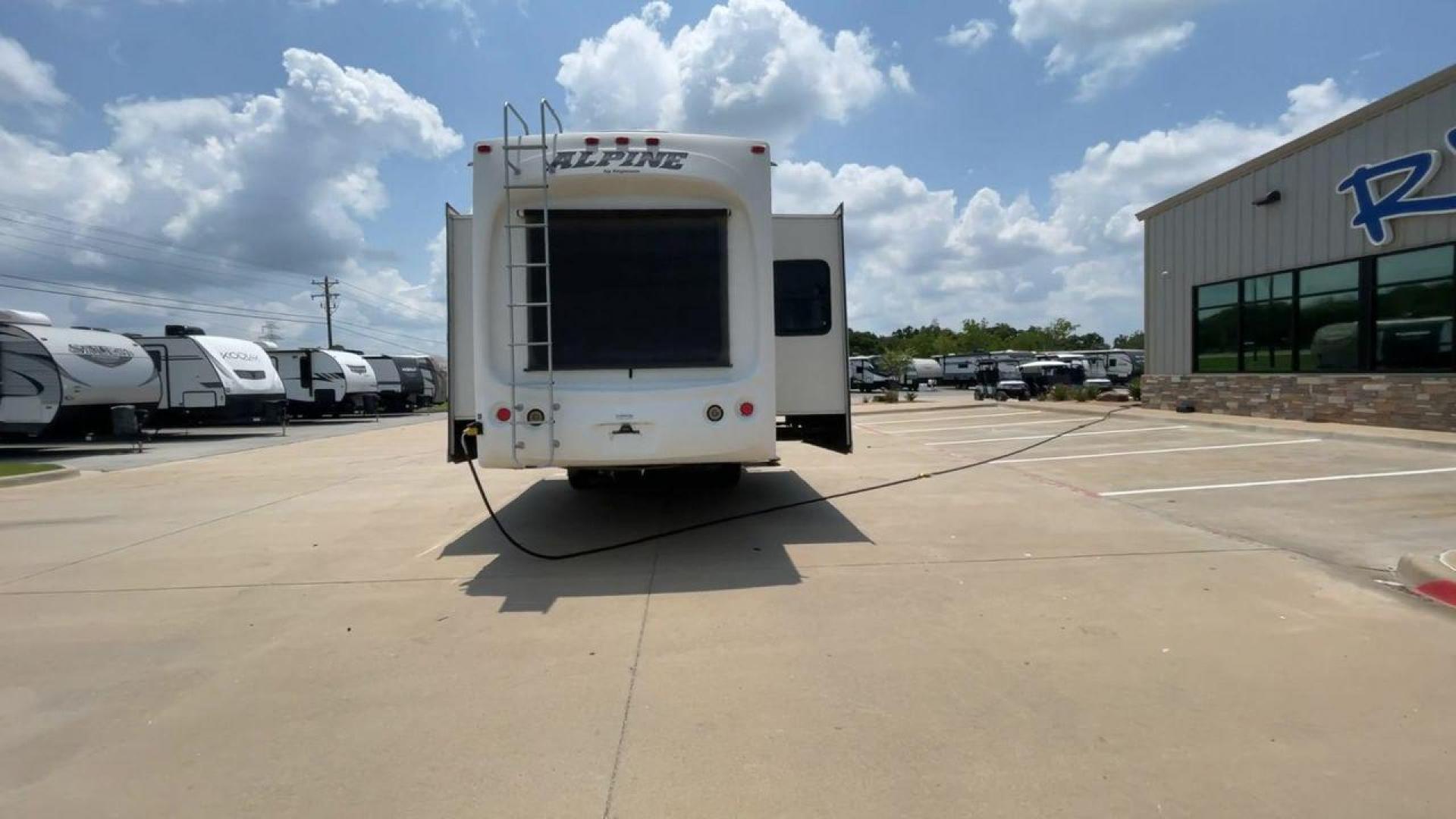 2013 WHITE KEYSTONE ALPNE 3720FB - (4YDF37227DE) , Length: 39.42 ft. | Dry Weight: 12,457 lbs. | Gross Weight: 15,500 lbs. | Slides: 4 transmission, located at 4319 N Main Street, Cleburne, TX, 76033, (817) 221-0660, 32.435829, -97.384178 - The 2013 Keystone Alpine 3720FB Travel Trailer provides a luxurious camping experience. This trailer is 39.42 feet long and has a dry weight of 12,457 lbs., providing plenty of space for relaxation and entertainment. Featuring four slides and convenient rear roof access, this RV offers ample space f - Photo#8